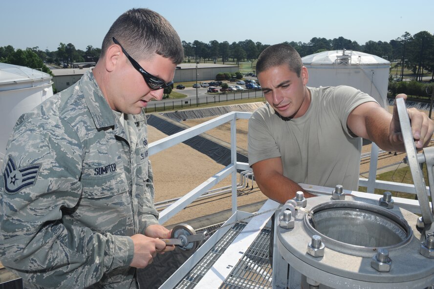 SEYMOUR JOHNSON AIR FORCE BASE, N.C. – Senior Airman Matthew Jones observes Staff Sgt. Shawn Sumpter reel a bob to the bottom of a 720,000 gallon fuel tank here during the 4th Logistics Readiness Squadron fuels  turkey shoot competition May 7, 2010. Sergeant Jones connects a bob to a tape measure to determine how much fuel is in the tank. Airman Jones, a 4th LRS fuels distribution operator, hails from West Deer, Pa. Sergeant Sumpter, a 4th LRS fuels distribution supervisor, is a native of Oak Hill, W.V. (U.S. Air Force photo/Staff Sgt. Heather Stanton)
