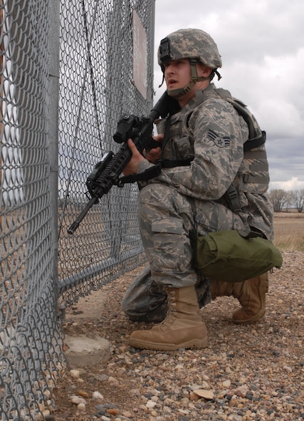 MINOT AIR FORCE BASE, N.D. -- Senior Airman Donald Ferguson, 91st Missile Security Forces Squadron security forces team member, surveys the launch facility to check for any signs of tampering here May 4. Security response team members are vital to the security of the missile field and Minot AFB assets. (U.S. Air Force photo by Airman 1st Class Aaron-Forrest Wainwright)