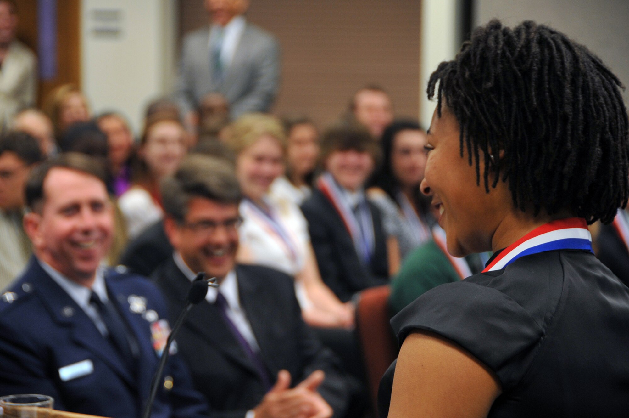 OFFUTT AIR FORCE BASE, Neb. -- Tonni Blount, a senior at Bellevue West High School in Bellevue, Neb., speaks to a large crowd during the Congressional Awards Medal Ceremony at the Bellevue Welcome Center May 7. Ms. Blount was the only gold medal recepient for 2010 here. Brig. Gen. John N.T. Shanahan, 55th Wing commander, Congressman Lee Terry and Dr. John Deegan, Bellevue Public Schools superintendent, also attended the ceremony. U.S. Air Force Photo by Jeff W. Gates.