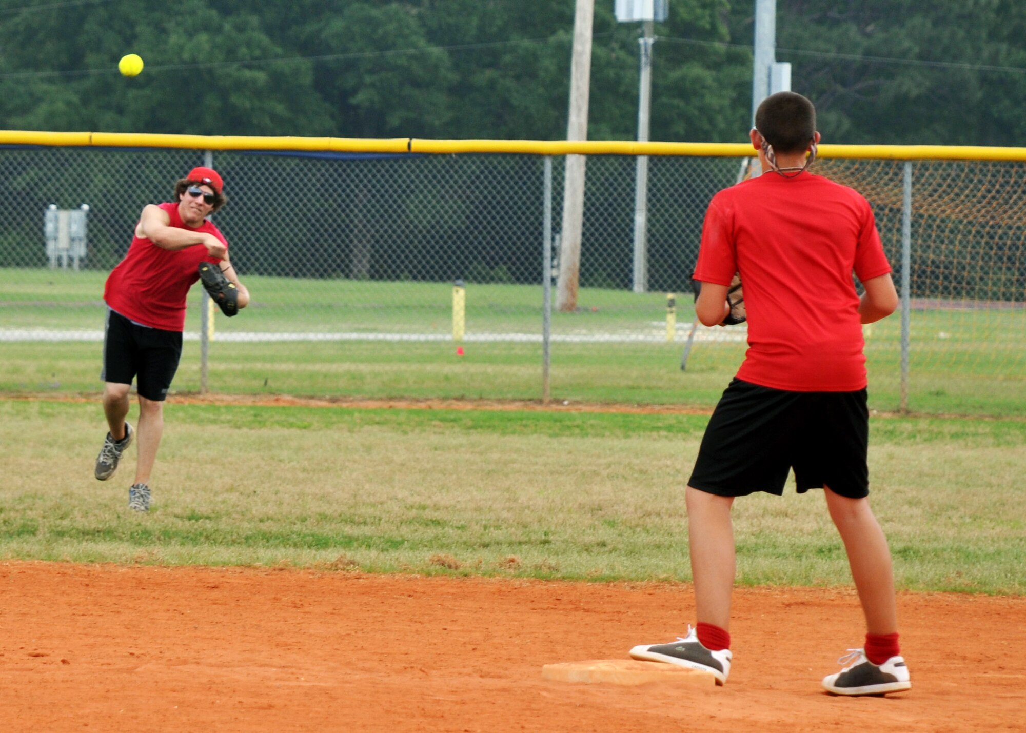 A Tyndall AFB player sends the throw to second base during the 2010 Police Week softball tournament held at Eglin Air Force Base, Fla., May 8.  96th Security Forces Squadron won the tournament with a perfect record.  Proceeds raised by the tournament will go to a police officers' memorial.  (U.S. Air Force photo/Ashley M. Wright.)