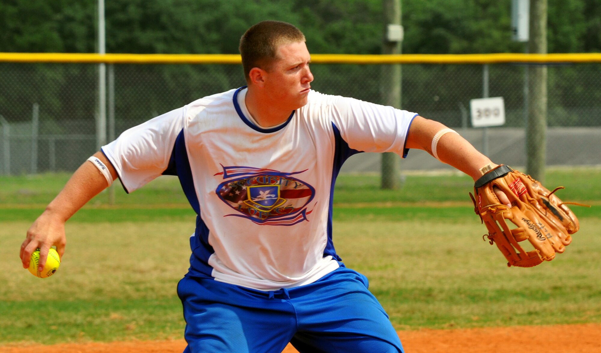 A player sends the throw to first base during the 2010 Police Week softball tournament held at Eglin Air Force Base, Fla., May 8.  96th Security Forces Squadron won the tournament with a perfect record.  Proceeds raised by the tournament will go to a police officers' memorial.  (U.S. Air Force photo/Ashley M. Wright.)