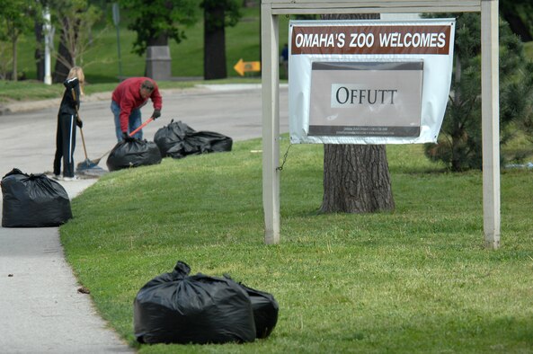 OFFUTT AIR FORCE BASE, Neb. -- Capt. Don Hudson, 55th Aircraft Maintenance Squadron, 83rd Aircraft Maintenance Unit, and his daughter Ashley, rake and pick up debris at the Henry Doorly Zoo in Omaha, Neb., May 8 during the zoo's annual clean up day. The father and daughter pair were part of a large group from Offutt who volunteered to clean the zoo. U.S. Air Force photo by Delanie Stafford