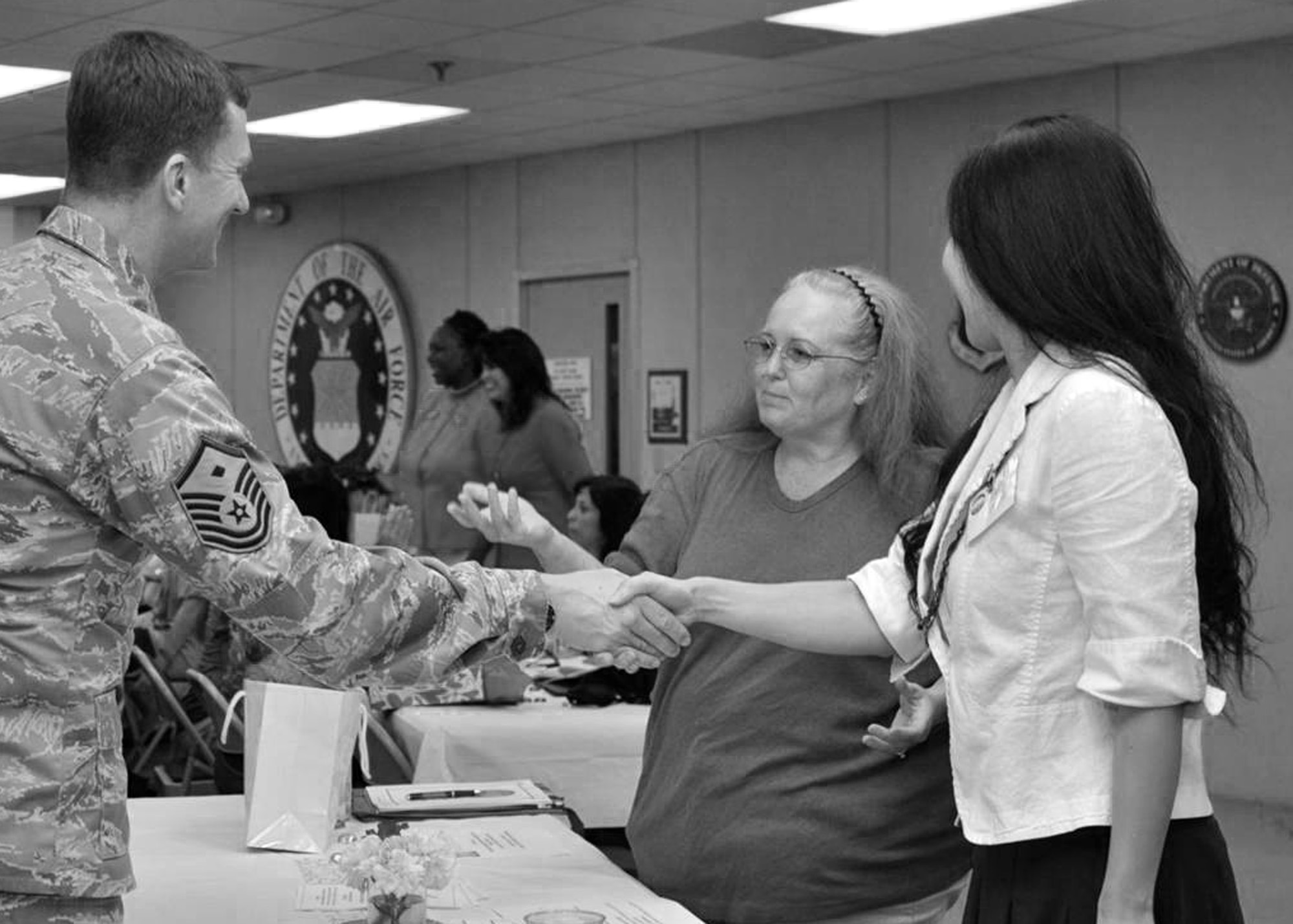 Master Sgt Jeff Bridgman, 96th Medical Squadron first sergeant, greets Team Eglin spouses at spouse apprecation event May 7 at Eglin Air Force Base, Fla.  (Courtesy photo.)