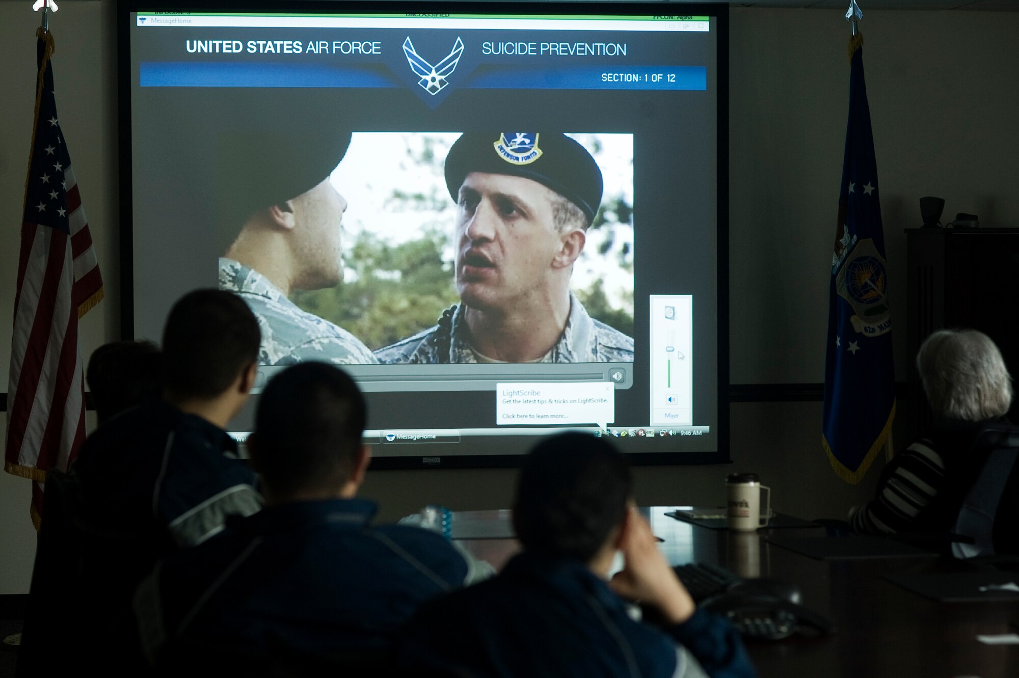 McChord Field Airmen watch an interactive suicide prevention video in the Maintenance Group conference room  as part of a Wingman Stand Down May 10 designed to call attention to the recent rise in Air Force suicides, the tragic loss of Airmen to private motor vehicle accidents, and to reenergize the Wingman concept as the foundation approach to suicide prevention and unit safety. (U.S. Air Force Photo by Abner Guzman)

