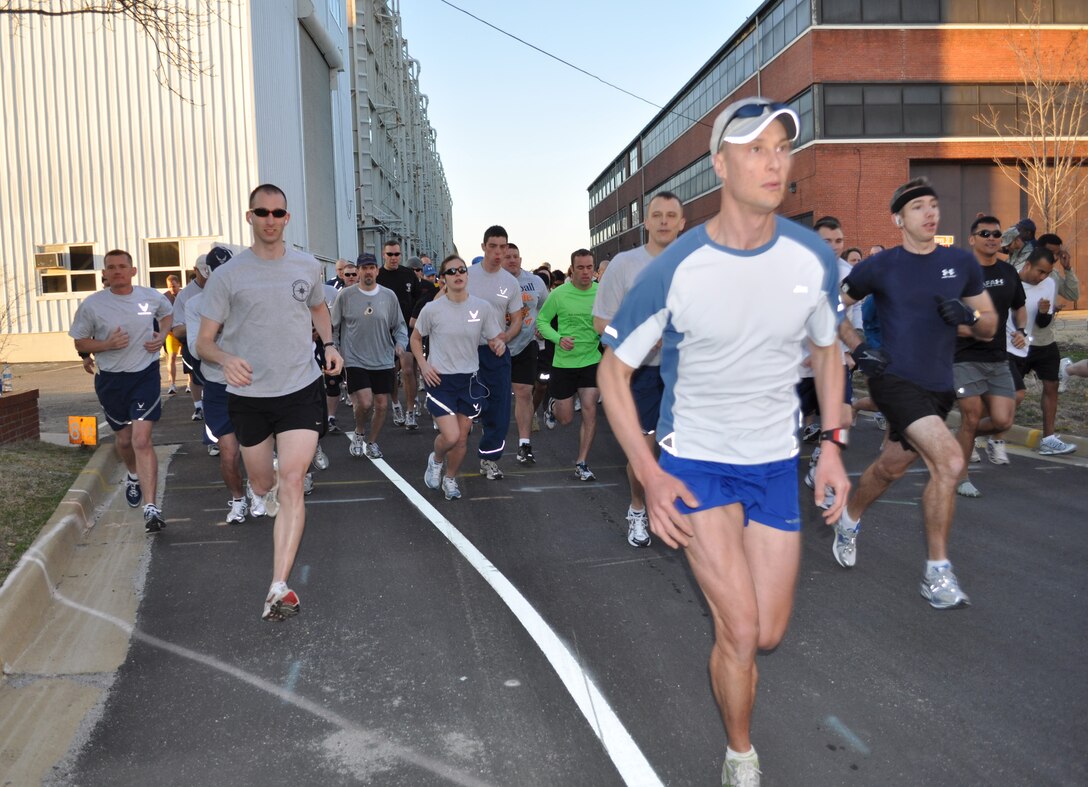 LANGLEY AIR FORCE BASE, Va. -- Runners start a 5K race on the base jogging trail March 19. The Langley's Biggest Loser program used events like 5K runs, fitness classes and weigh-ins to keep participants on the road to healthier lifestyles. (Courtesy photo)