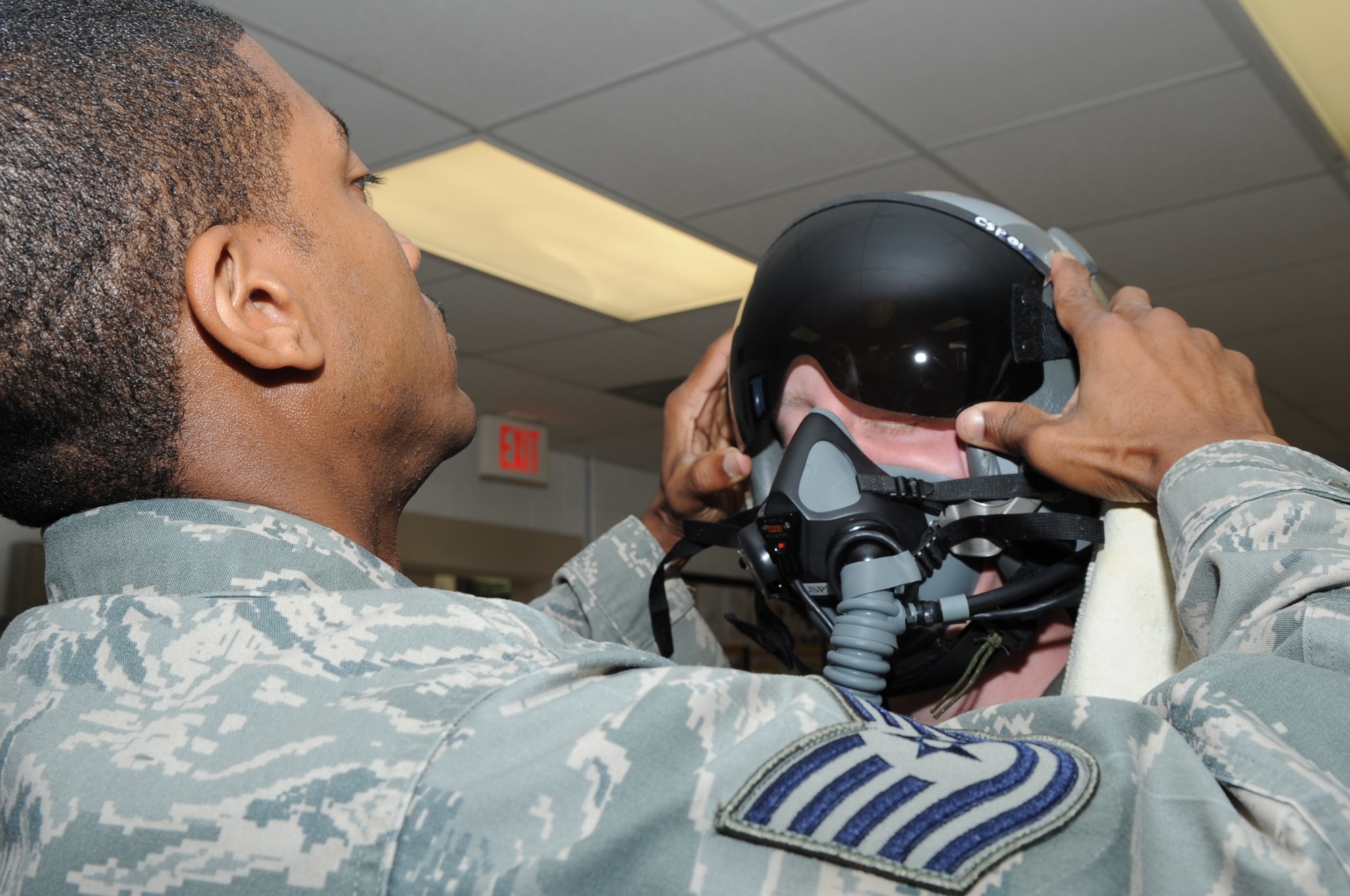 SEYMOUR JOHNSON AIR FORCE BASE, N.C. -- Tech. Sgt. Alvin Edmunds checks functionality of an aircrew member's helmet during an aircrew flight equipment competition here, May 6, 2010. Aircrew technicians test and adjust head gear to each aircrew member's head to prevent air leaks during flight. Sergeant Edmunds, 4th Operations Support Squadron aircrew flight equipment technician, is from Danville, Va. (U.S. Air Force photo/Staff Sgt. Courtney Richardson) 