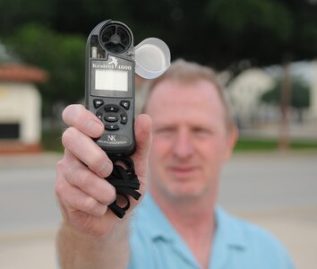 Terry Roberts, a meteorologist technician with the 12th Operations Support Squadron Weather Operations Flight at Randolph Air Force Base, TX, uses a Kestrel Device to verify air temperature, dew point and wind velocity, as part of the weather forecasting information provided to pilots prior to flying a sortie.  (U.S. Air force Photo By Don Lindsey)