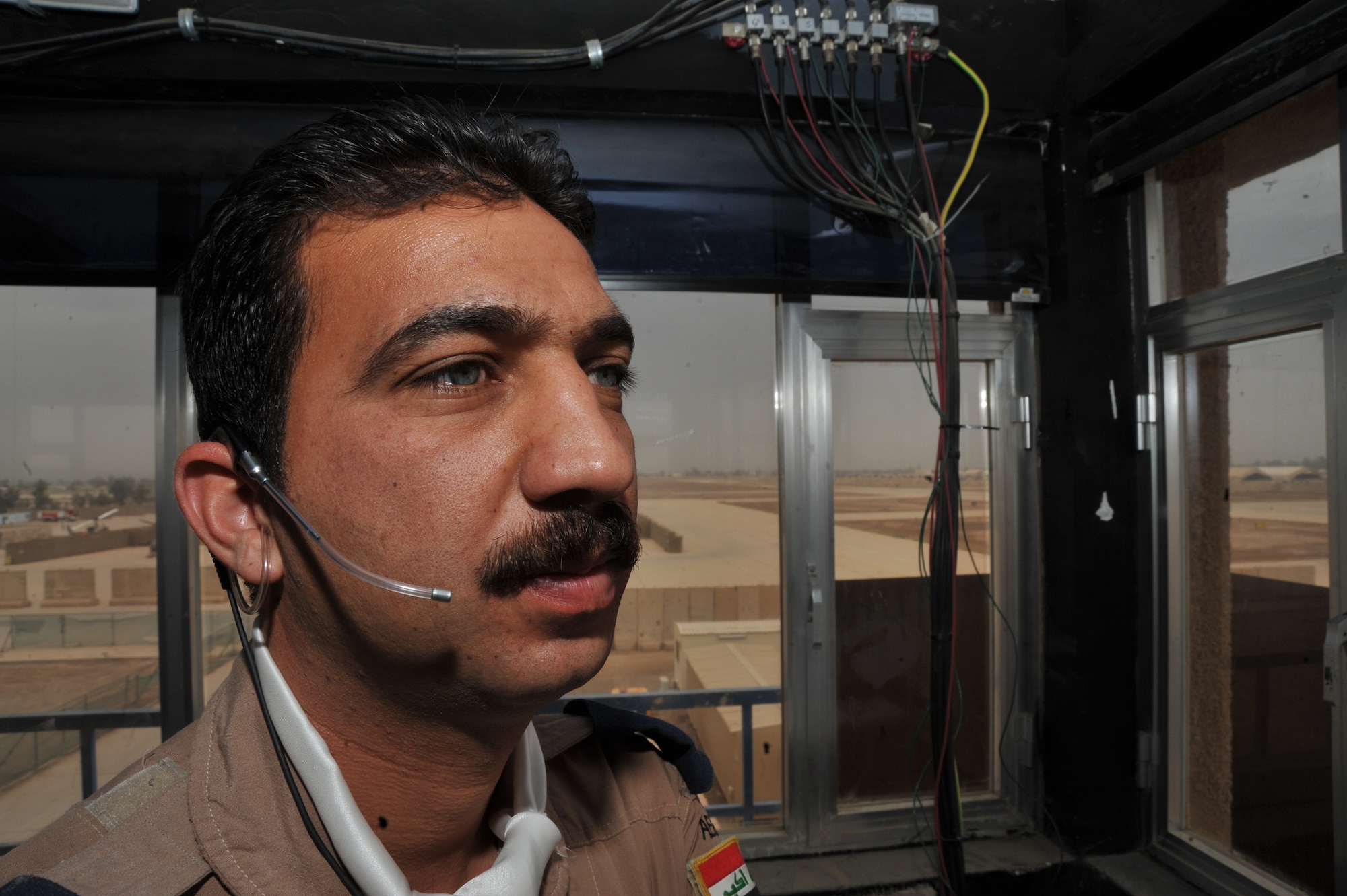 Iraqi Air Force air traffic controller 2nd Lt. Shorsh Abdillah listens for air traffic at Camp Taji, Iraq April 17, 2010.  (U.S. Air Force photo/Staff Sgt Quinton Russ/released)