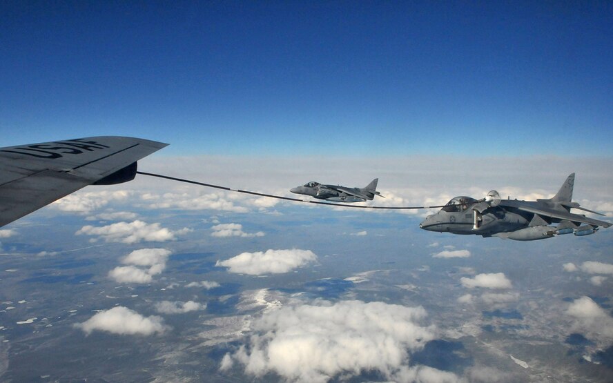 A Marine AV-8B Harrier from VMA-211, Marine Corps Air Station, Yuma, Ariz., uses a drogue to refuel from a KC-135 Stratotanker from McConnell Air Force Base, Kansas, during Red Flag-Alaska April 21. Red Flag-Alaska is a field training exercise that provides joint offensive counter-air, interdiction, close air support, and large force employment training in a simulated combat environment. (U.S. Air Force photo/Capt. Shannon Collins)