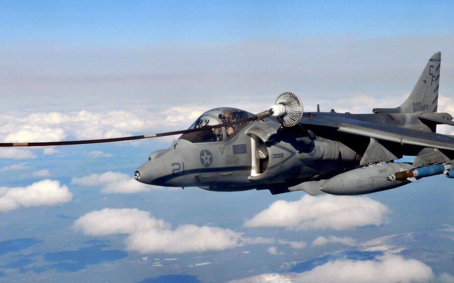A Marine AV-8B Harrier from VMA-211, Marine Corps Air Station, Yuma, Ariz., uses a drogue to refuel from a KC-135 Stratotanker from McConnell Air Force Base, Kansas, during Red Flag-Alaska April 21. Red Flag-Alaska is a field training exercise that provides joint offensive counter-air, interdiction, close air support, and large force employment training in a simulated combat environment. (U.S. Air Force photo/Capt. Shannon Collins)