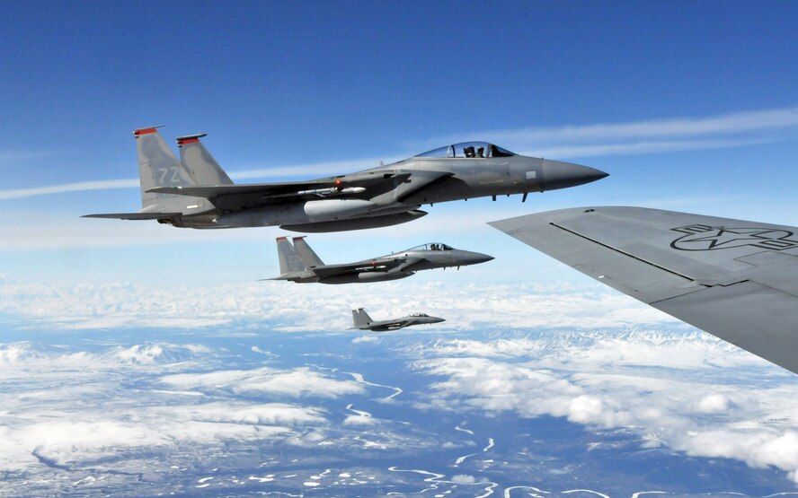 F-15 Eagle pilots from Kadena Air Base, Japan, wait for their wingman to refuel from a KC-135 Stratotanker from Fairchild Air Force Base, Wash., before receiving fuel themselves during Red Flag-Alaska April 27. Red Flag-Alaska is a field training exercise that provides joint offensive counter-air, interdiction, close air support, and large force employment training in a simulated combat environment. (U.S. Air Force photo/Capt. Shannon Collins) 