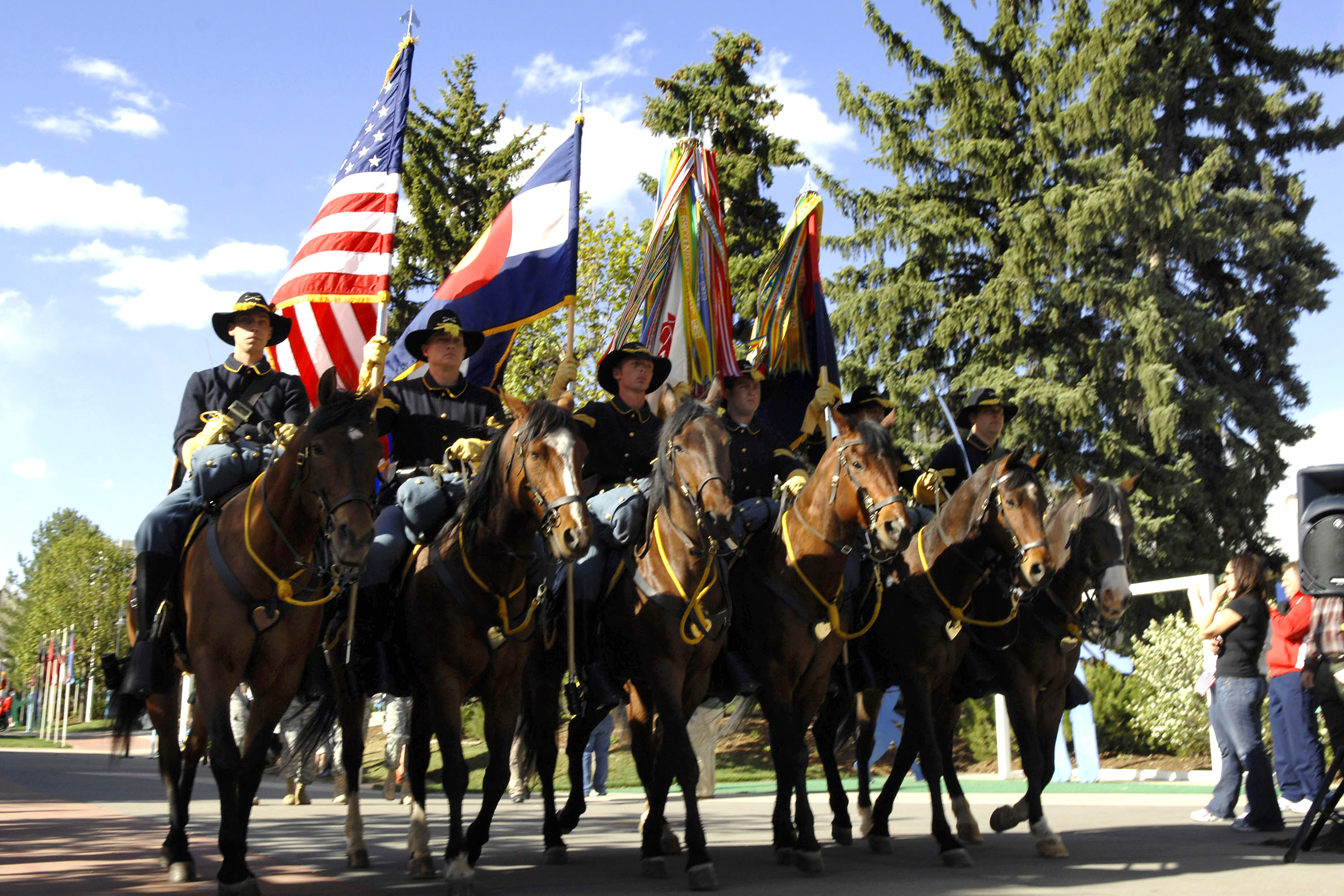 A color guard from Fort Carson's 4th Infantry Division marches down ...