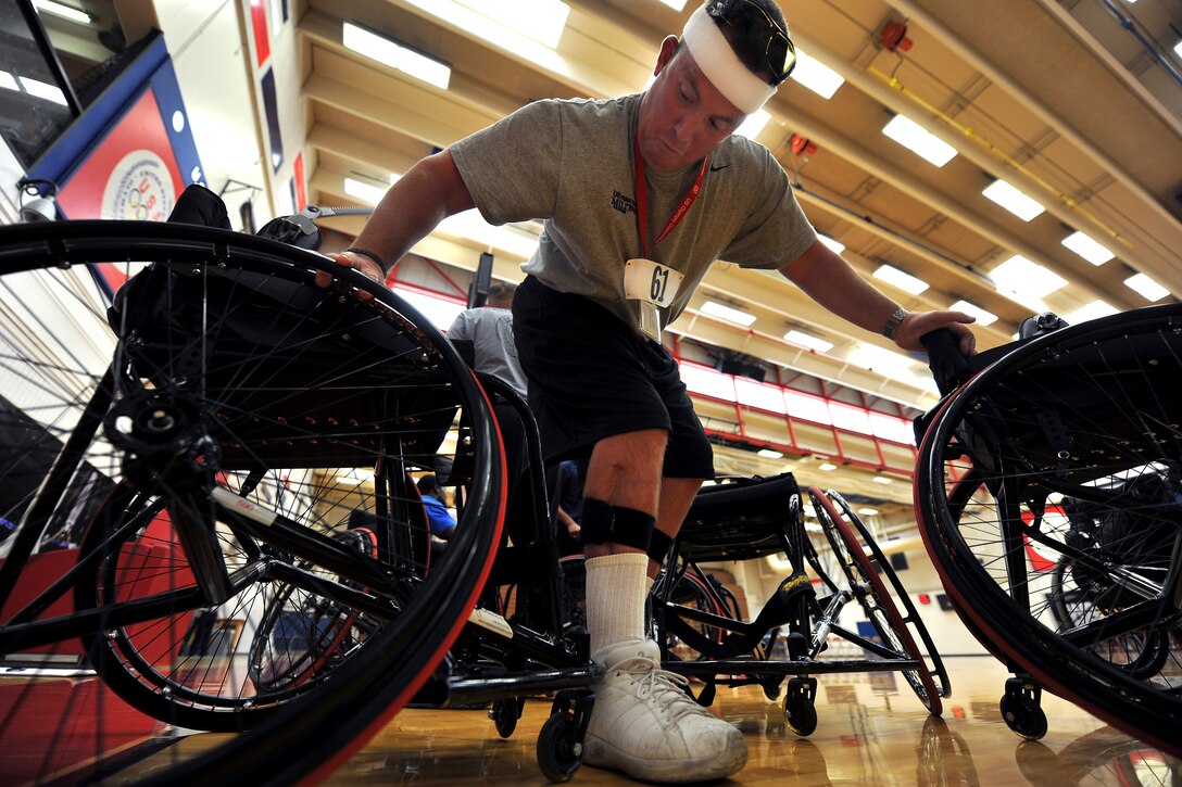 U.S. Air Force Staff Sgt. Richard Pollock sits in a wheelchair as he prepares to practice basketball at the Olympic Training Center in Colorado Springs, Colo., May 10, 2010. Pollock is a member of the Air Force team participating in the inaugural Warrior Games.