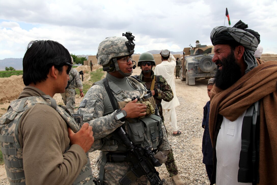 U.S. Army 1st. Lt. Harold Castweda, center, talks with an Afghan village elder about any improvements that can be made to a mosque in the village of Dubazai at Logar province, Afghanistan, May 9, 2010. Castweda is assigned to 173rd Brigade Support Battalion, which conducted a security check of the village.