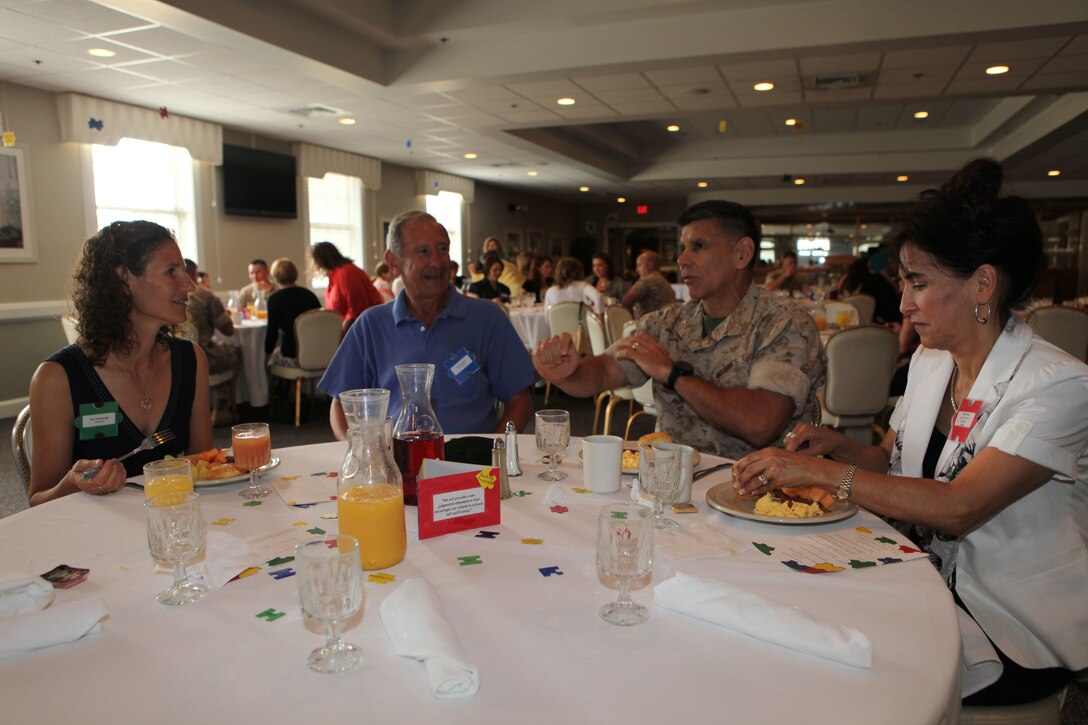 (from left to right): Navy-Marine Corps Relief Society volunteer Ruth McDonough; Stephen Rosenthal, McDonough’s father; Brig. Gen. Juan G. Ayala, commanding general of 2nd Marine Logistics Group; and Mrs. Diane Ayala, wife of the 2nd MLG commanding general, have breakfast during the NMCRS Volunteer Awards and Recognition Ceremony aboard Marine Corps Base Camp Lejeune, May 12.   Personnel from the NMCRS and service members aboard the base gathered together to show their support and gratitude of these NMCRS volunteers for their time and efforts in providing financial, educational, medical and other assistance to Marines and sailors in a time of need.