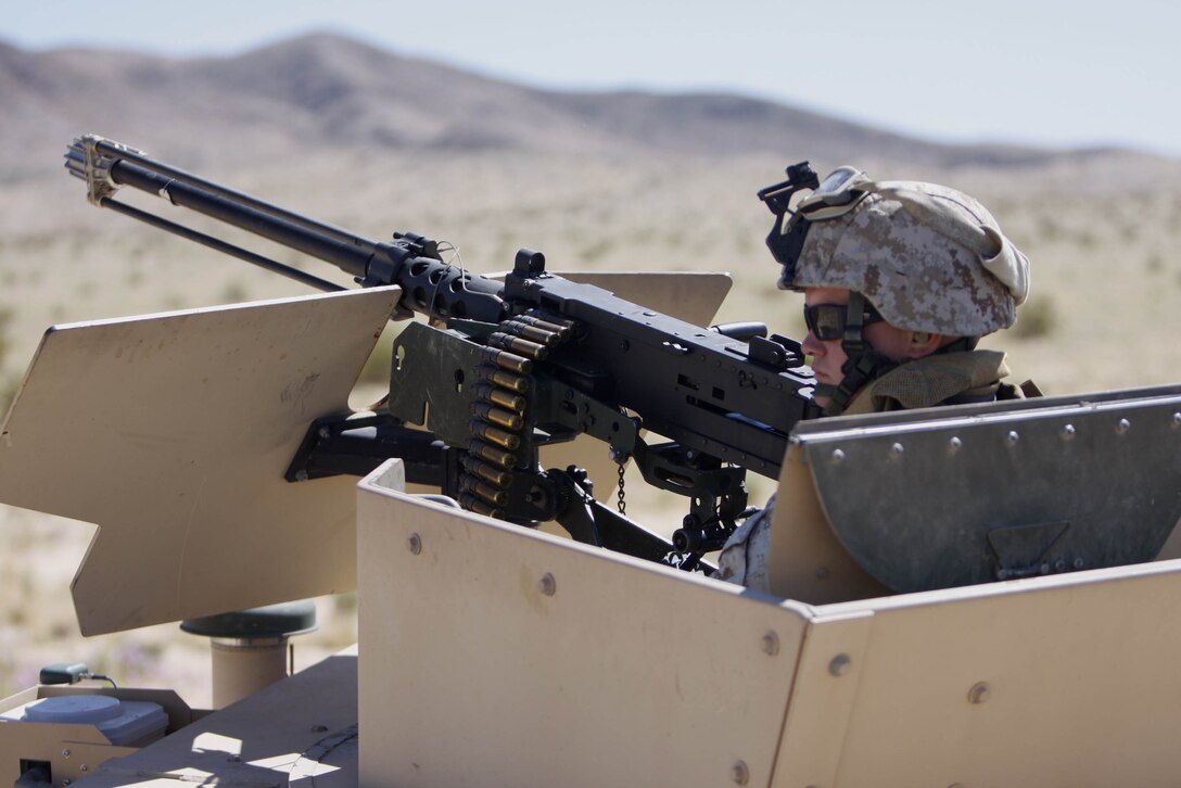 Lance Cpl. Sam Leprohan, a motor transportation operator with 11th Marine Regiment's Civil Affairs Team 3, provides security for the rest of the team May 12 at Combat Center Range 220. The Advisor Training Group here trained the Marines in basic convoy operations skills.