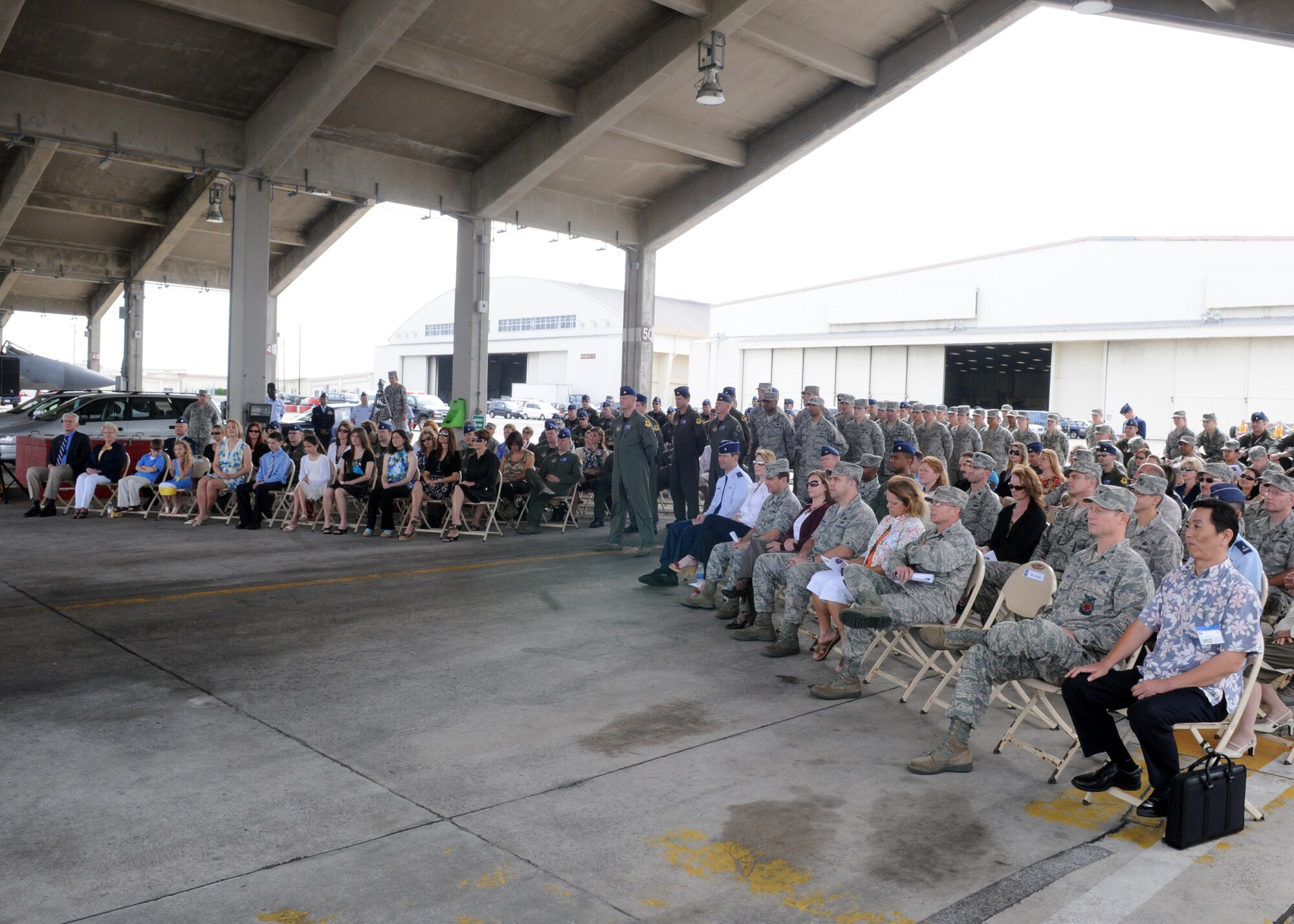 Kadena Airmen and family members attend the 18th Operations Support Squadron change of command May12, 2010. Lt. Col. David Mineau assumed command of the squadron and Lt. Col. Joseph Coogan relinquished command earlier during the ceremony.  (U.S. Air Force photo/Staff Sgt. Chris Hummel)        