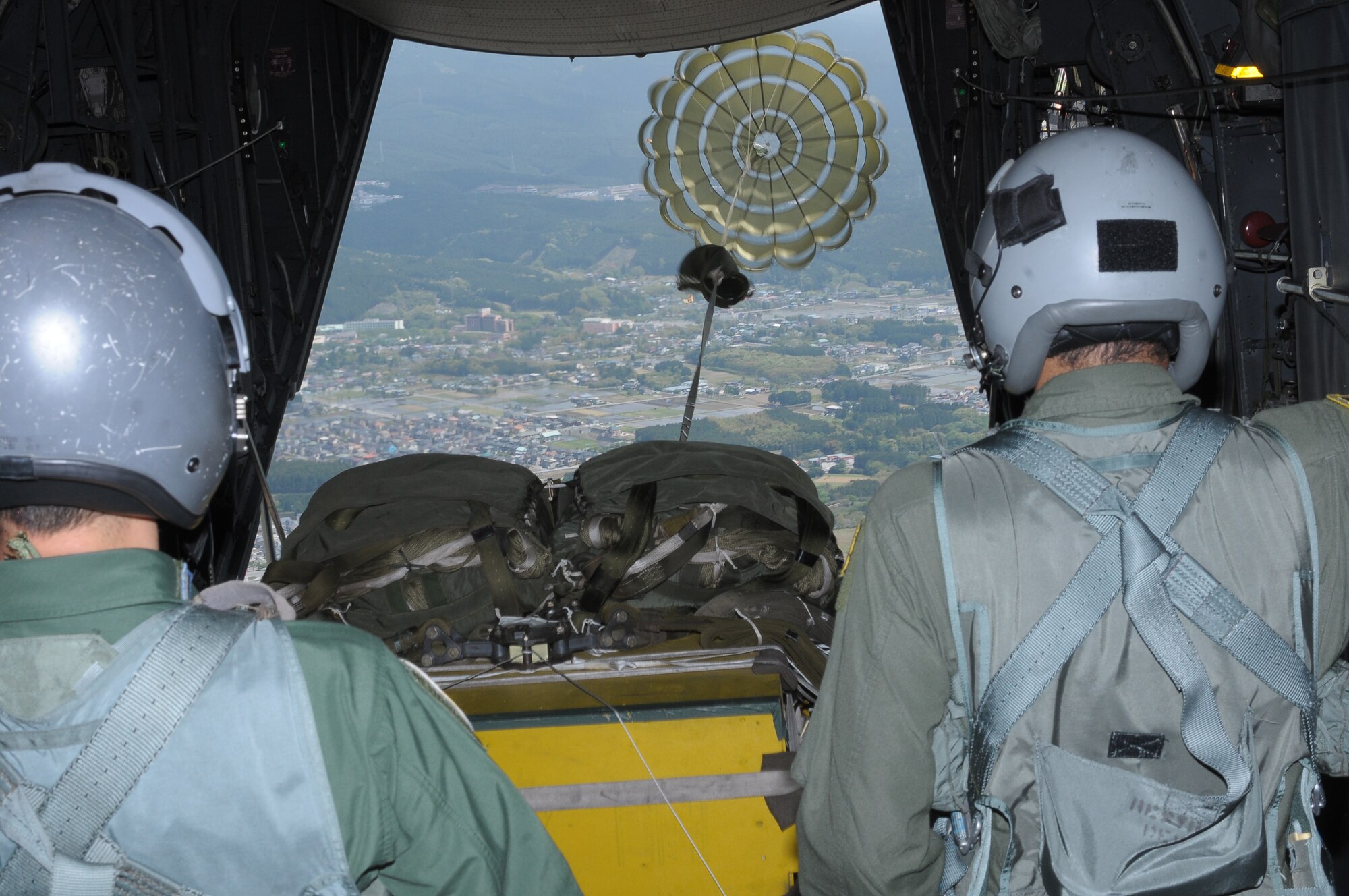 YOKOTA AIR BASE, Japan -- A heavy equipment bundle is released from a C-130 Hercules May 6 during a Joint Air Delivery Inspection. (U.S. Air Force photo/Airman 1st Class Sean Martin)