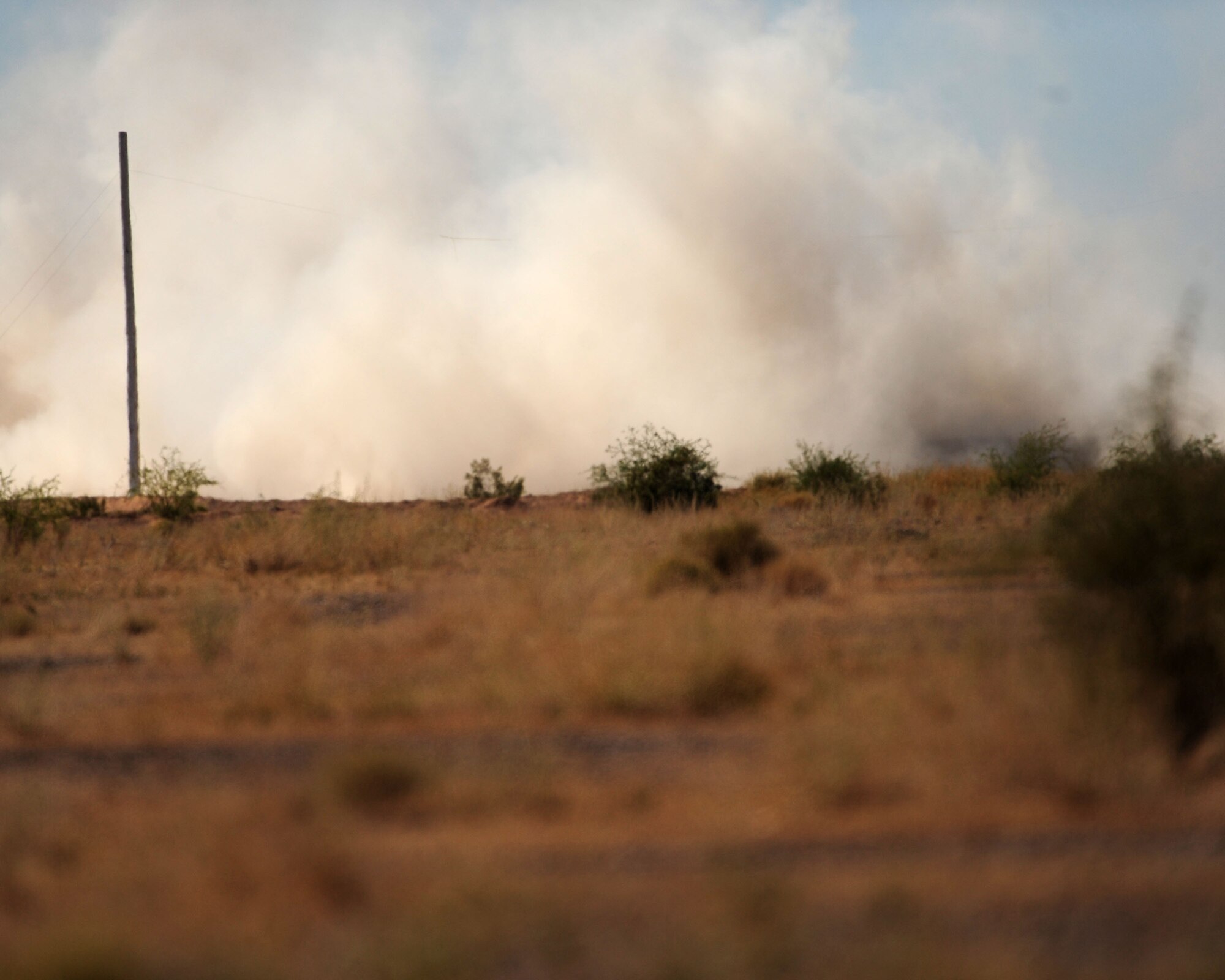 While at the Barry M. Goldwater range May 3, dust and smoke fill the air as 1st Lt. Dan Griffin fires the A-10C’s 30mm Gatling gun for the first time. Lieutenant Griffin is a student in the A-10C Pilot Initial Qualification course. To learn more about his journey through the course, check out “Behind the Scenes: The Making of an A-10C Pilot” at www.dm.af.mil. (U.S. Air Force photo/Airman Jerilyn Quintanilla)

