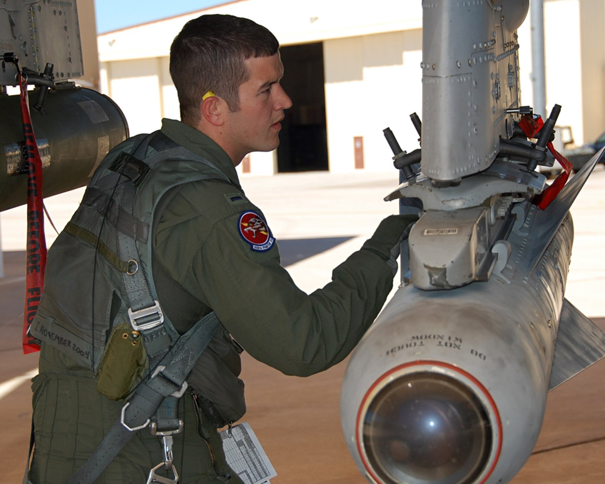 Prior to his flight May 3 to the Barry M. Goldwater Range, 1st Lt. Dan Griffin, a pilot from the 358th Fighter Squadron, inspects his A-10C aircraft. Lieutenant Griffin is a student in the A-10C Pilot Initial Qualification course and upon completion of this course he will be a fully qualified A-10C pilot. (U.S. Air Force photo/Capt. Stacie N. Shafran)