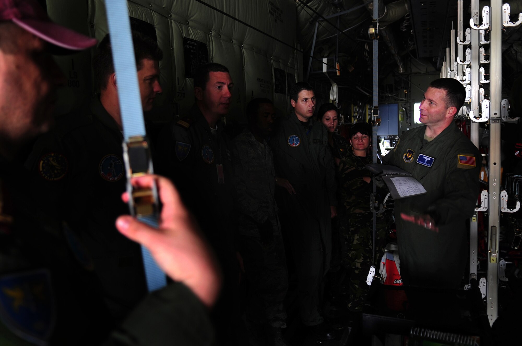 U.S. Air Force Senior Master Sgt. Patrick Skiver 86th Aeromedical Evacuation Squadron superintendant, familiarizes Romanian Air Force medical evacuation counterparts with equipment and procedures used to evacuate patients on a C-130J during the joint exercise Carpathian Summer, Airlift Base Otopeni, Romania, May 12, 2010. Carpathian Summer 2010 was an exercise in which the Romanian Air Force invited members of the U.S. military to train with them on their soil and air space, to observe and practice, firsthand, operations in action. This exercise was designed to build partnerships between these nations in an effort to work together more efficiently during real world scenarios. (U.S. Air Force Photo by Staff Sgt. Jocelyn Rich)