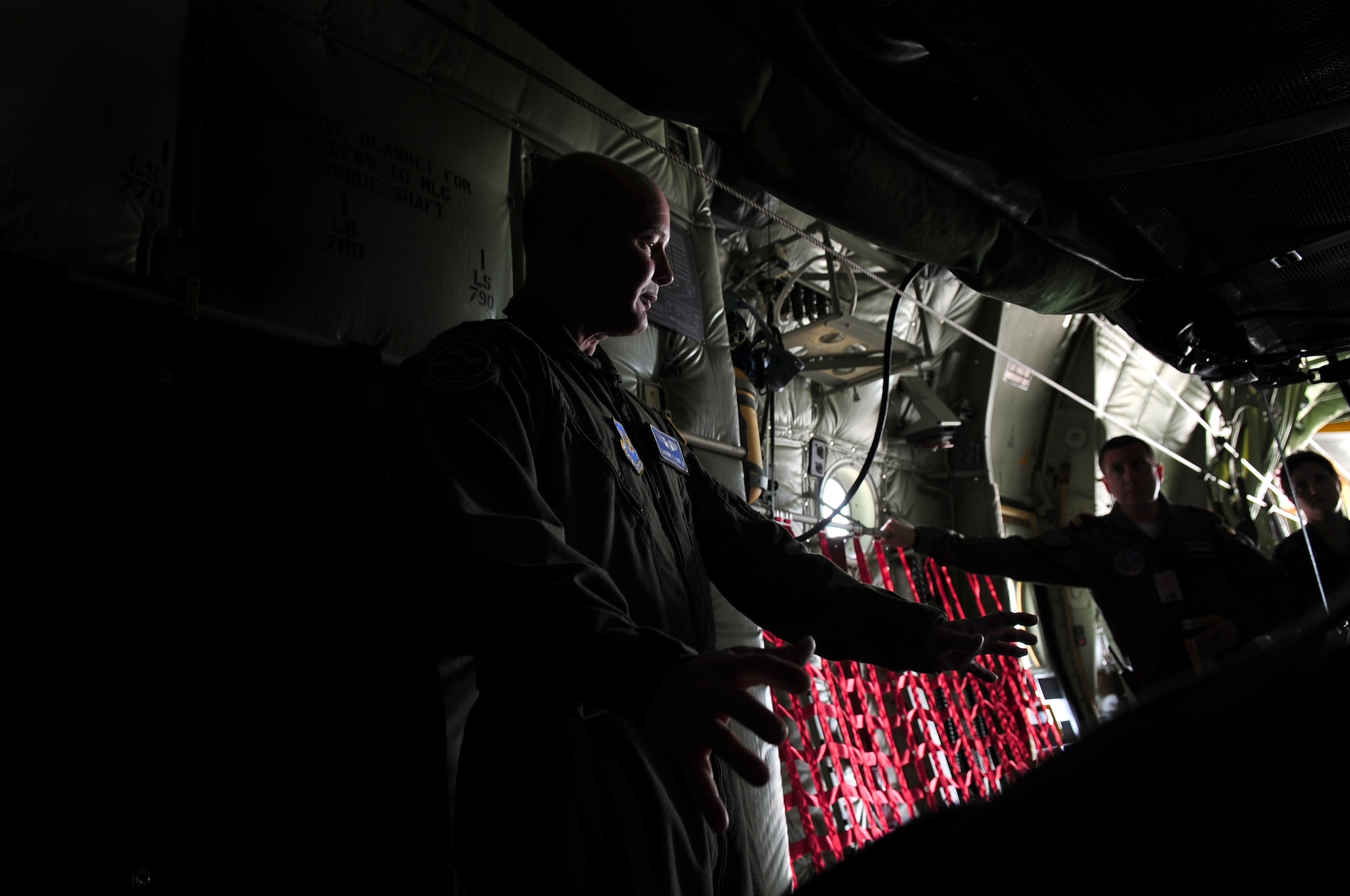 U.S. Air Force Captain Erskine Cook Jr., 86th Aeromedical Evacuation Squadron flight nurse, familiarizes Romanian Air Force medical evacuation counterparts with equipment and procedures used to evacuate patients on a C-130J during the joint exercise Carpathian Summer, Airlift Base Otopeni, Romania, May 12, 2010. Carpathian Summer 2010 was an exercise in which the Romanian Air Force invited members of the U.S. military to train with them on their soil and air space, to observe and practice, firsthand, operations in action. This exercise was designed to build partnerships between these nations in an effort to work together more efficiently during real world scenarios. (U.S. Air Force Photo by Staff Sgt. Jocelyn Rich)