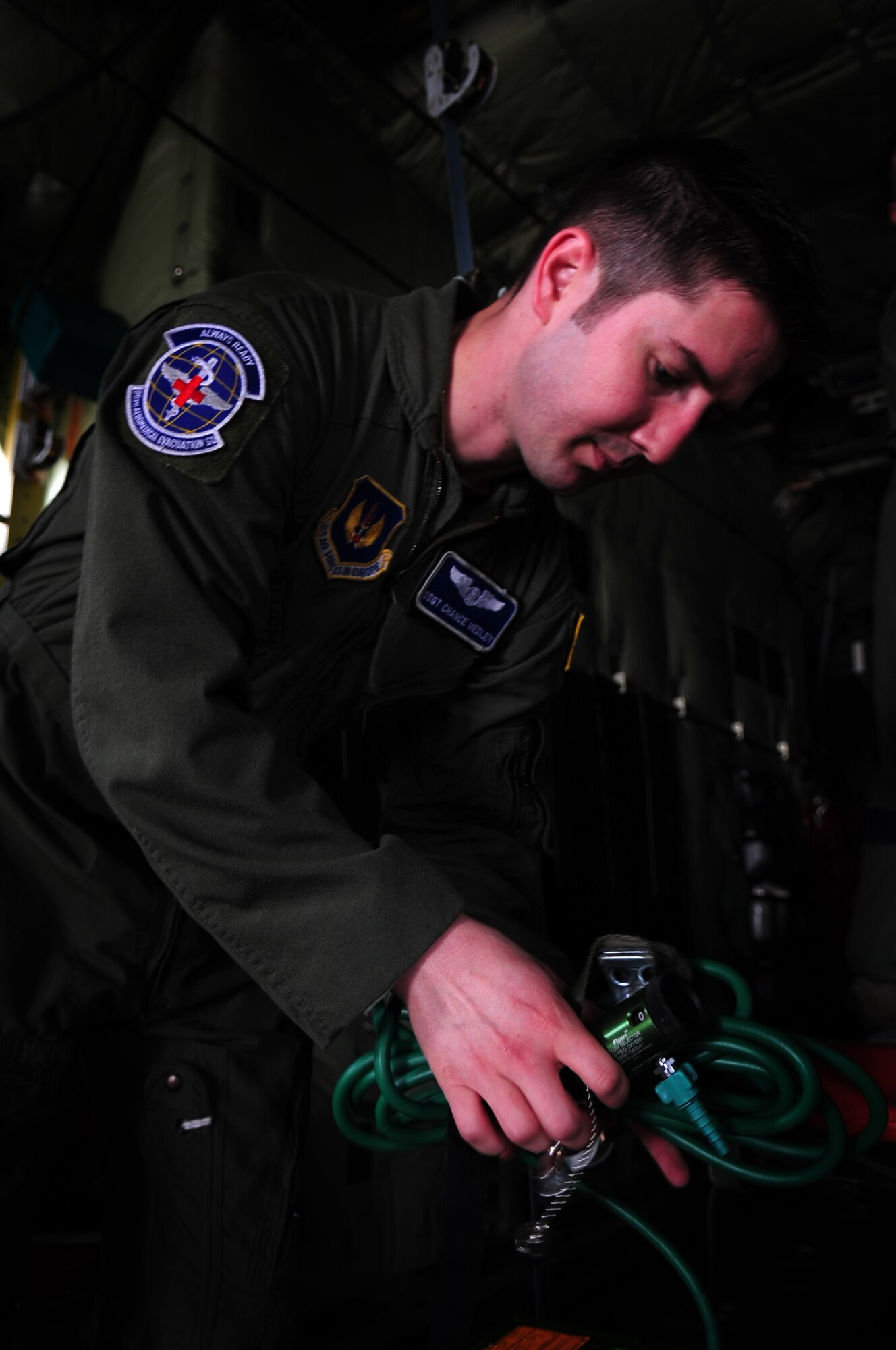 U.S. Air Force Staff Sgt. Chance Medley, 86th Aeromedical Evacuation Squadron medical evacuation technician, prepares an oxygen supply unit prior to conducting training with the Romanian Air Force counter parts on aeromedical evacuation equipment and procedures on a C-130J during the joint exercise Carpathian Summer, Otopeni Airlift Base, Romania, May 12, 2010. Carpathian Summer 2010 was an exercise in which the Romanian Air Force invited members of the U.S. military to train with them on their soil and air space, to observe, firsthand, operations in action. This exercise was designed to build partnerships between these nations in an effort to work together more efficiently during real world scenarios. (U.S. Air Force Photo by Staff Sgt. Jocelyn Rich)