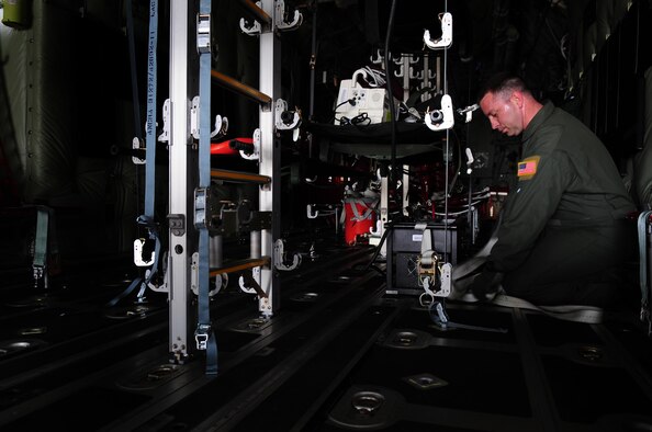 U.S. Air Force Senior Master Sgt. Patrick Skiver, 86th Aeromedical Evacuation Squadron superintendant, prepares litters and aeromedical evacuation equipment on a C-130J in preparation of training Romanian Air Force counterparts on equipment and procedures used to evacuate patients during the joint exercise Carpathian Summer, Airlift Base Otopeni, Romania, May 12, 2010. Carpathian Summer 2010 was an exercise in which the Romanian Air Force invited members of the U.S. military to train with them on their soil and air space, to observe, firsthand, operations in action. This exercise was designed to build partnerships between these nations in an effort to work together more efficiently during real world scenarios. (U.S. Air Force Photo by Staff Sgt. Jocelyn Rich)