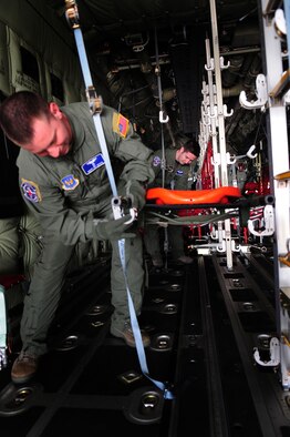 U.S. Air Force Senior Master Sgt. Patrick Skiver and Staff Sgt. Chance Medley, 86th Aeromedical Evacuation Squadron prepare litters and aeromedical evacuation equipment on a C-130J in preparation of training Romanian Air Force counterparts on equipment and procedures used to evacuate patients during the joint exercise Carpathian Summer, Otopeni Airlift Base, Romania, May 12, 2010. Carpathian Summer 2010 was an exercise in which the Romanian Air Force invited members of the U.S. military to train with them on their soil and air space, to observe, firsthand, operations in action. This exercise was designed to build partnerships between these nations in an effort to work together more efficiently during real world scenarios. (U.S. Air Force Photo by Staff Sgt. Jocelyn Rich)