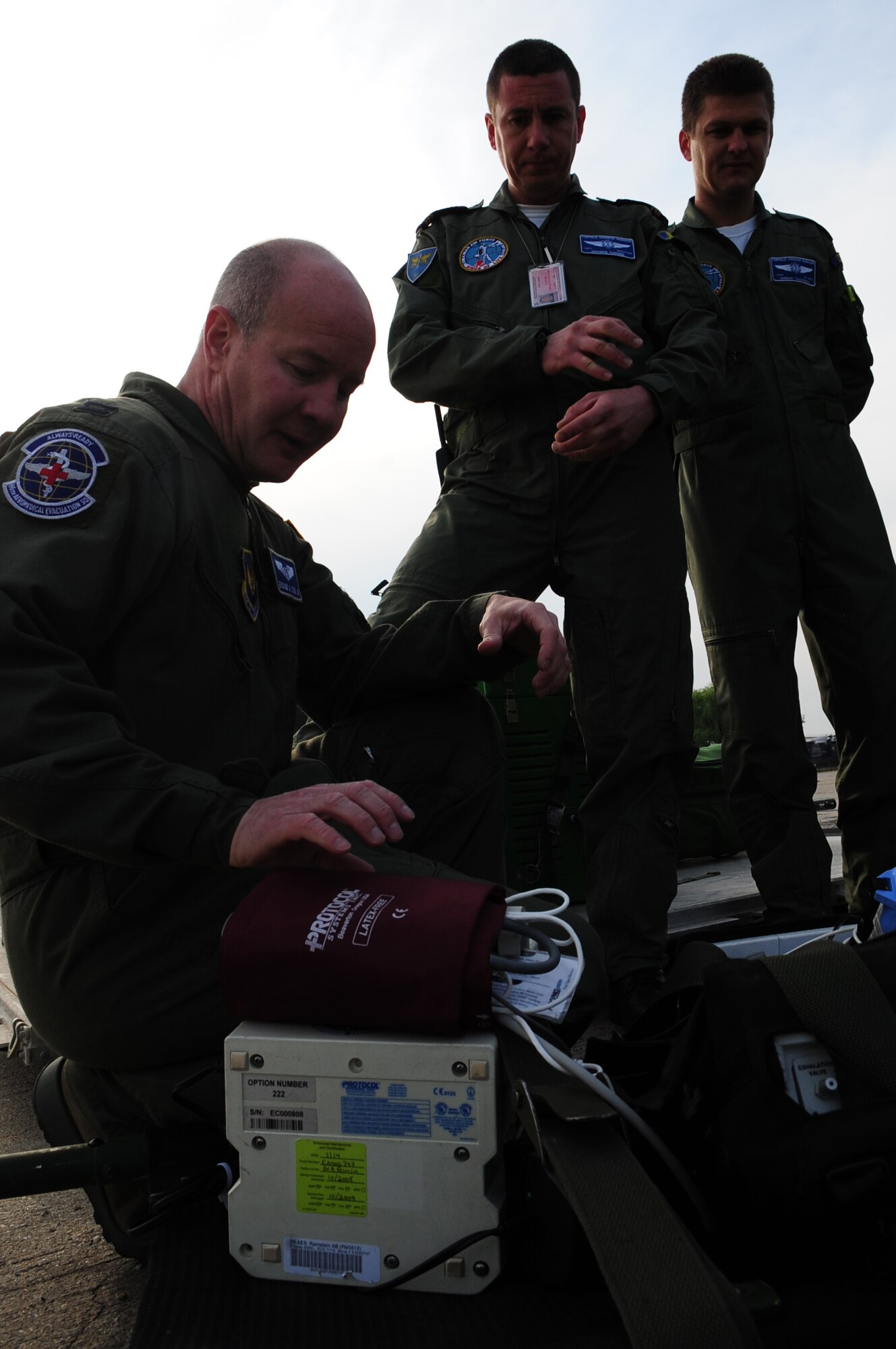 U.S. Air Force Capt. Erskine Cook Jr., 86th Aeromedical Evacuation Squadron flight nurse, familiarizes Romanian Air Force medical evacuation counterparts with equipment and procedures used to evacuate patients during the joint exercise Carpathian Summer, Airlift Base Otopeni, Romania, May 12, 2010. Carpathian Summer 2010 was an exercise in which the Romanian Air Force invited members of the U.S. military to train with them on their soil and air space, to observe, firsthand, operations in action. This exercise was designed to build partnerships between these nations in an effort to work together more efficiently during real world scenarios. (U.S. Air Force Photo by Staff Sgt. Jocelyn Rich)