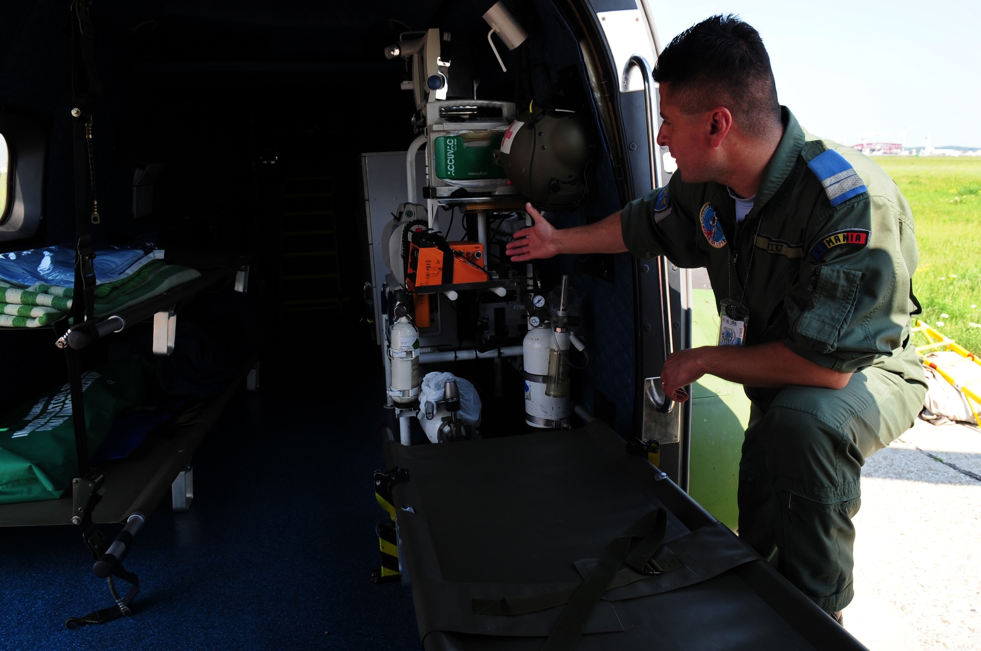 Romanian Air Force medical evacuation technician Dumitru Miu, familiarizes U.S. Air Force counterparts from the 86th Aeromedical Evacuation Squadron with medical equipment used on the Romanian Air Force Puma helicopter for medivac mission during the joint exercise Carpathian Summer, Airlift Base Otopeni, Romania, May 11, 2010. Carpathian Summer 2010 was an exercise in which the Romanian Air Force invited members of the U.S. military to train with them on their soil and air space, to observe, firsthand, operations in action. This exercise was designed to build partnerships between these nations in an effort to work together more efficiently during real world scenarios. (U.S. Air Force Photo by Staff Sgt. Jocelyn Rich)