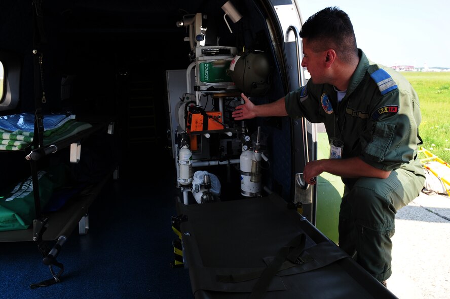Romanian Air Force medical evacuation technician Dumitru Miu, familiarizes U.S. Air Force counterparts from the 86th Aeromedical Evacuation Squadron with medical equipment used on the Romanian Air Force Puma helicopter for medivac mission during the joint exercise Carpathian Summer, Airlift Base Otopeni, Romania, May 11, 2010. Carpathian Summer 2010 was an exercise in which the Romanian Air Force invited members of the U.S. military to train with them on their soil and air space, to observe, firsthand, operations in action. This exercise was designed to build partnerships between these nations in an effort to work together more efficiently during real world scenarios. (U.S. Air Force Photo by Staff Sgt. Jocelyn Rich)