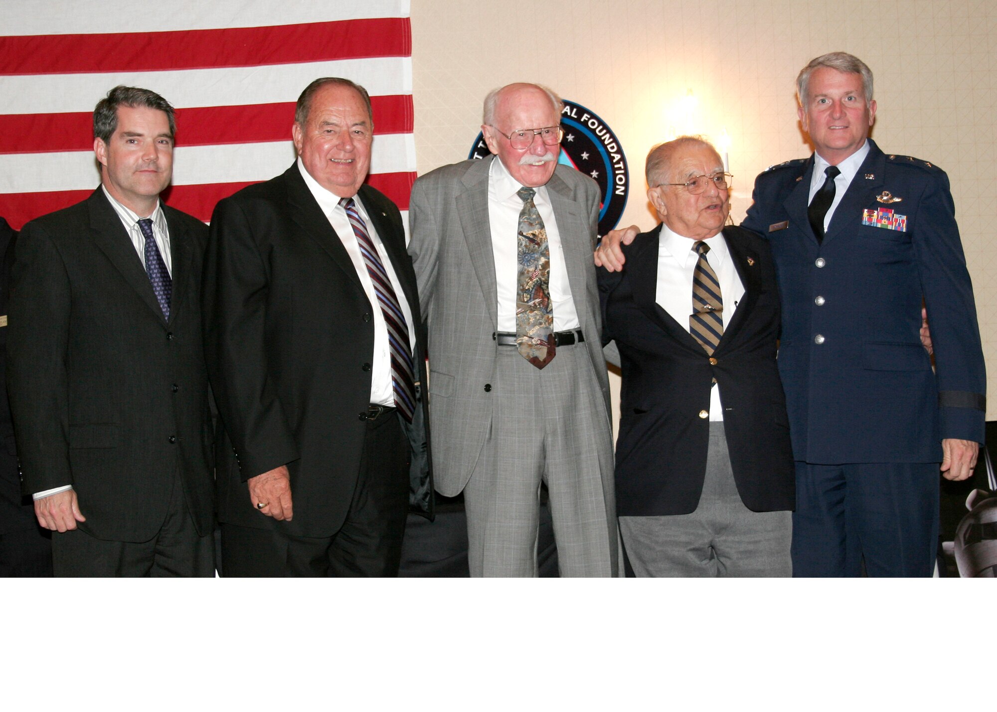 Air Force World War II pilot David Tallichet was posthumously awarded an Excellence in Aviation award at the Excellence in Aviation awards event held May 8 at the Proud Bird Restaurant in Inglewood, Calif. Mr. Tallichet’s award was received by his son John. Pictured in photo from left: John Tallichet; Korean War Air National Guard pilot Clay Lacy; retired fighter pilot Bob Hoover; retired USAF Brig. Gen. Robert “Bob” Cardenas and Maj. Gen. David Eichhorn, Air Force Flight Test Center commander. (Aerotech News photo by Linda KC Reynolds)