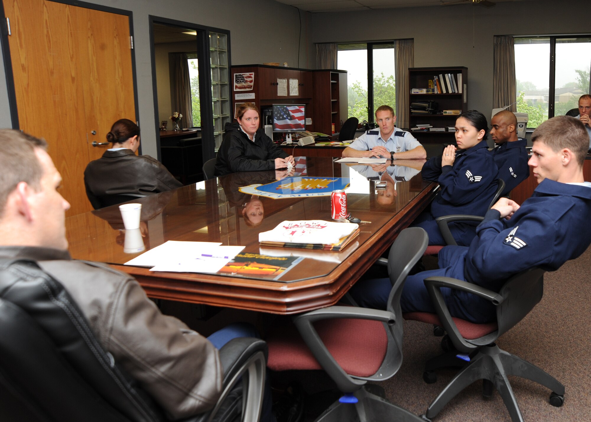 Team McConnell Airmen from Protocol, Commander’s Action Group and Wing Administration units discuss suicide and motor vehicle mishaps during Air Mobility Command’s Wingman Stand Down May 10, 2010, McConnell Air Force Base, Kan. AMC paused daily operations May 10 to allow Airmen to participate in the Wingman Stand Down event. The event was designed to revise individual’s perspective on the Wingman concept, emphasize suicide prevention and improve unit safety. (U.S. Air Force photo/Airman 1st Class Andrea Salazar)