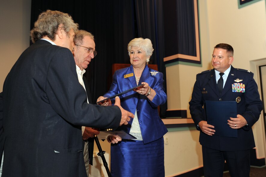 Helen Hunt Rigdon, representing Congressman Jeff Miller, and 505th Command and Control Wing Commander Col. Edward McKinzie present certificates of appreciation to Herman Snyder (left) and Dr. Victor Sapio (second from left) for participating in Hurlburt Field's Annual Holocaust Remembrance Ceremony May 4. The event was hosted by the 505th CCW on behalf of the 1st Special Operations Wing. The theme of this year's observance is "Stories of Freedom: What You Do Matters." (U.S. Air Force Photo by Senior Airman Matthew R. Loken)