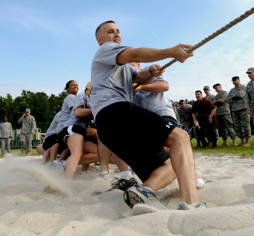 Airmen from the 628th Security Forces Squadron give it their all during a game of tug-o-war at the Guns vs. Hoses competition on Joint Base Charleston, S.C., May 7, 2010. This year marked the second annual competition held between the 628th Security Forces Squadron and the 628th Civil Engineer Squadron. A number of events took place and the winner of each event earned points for their squadron. The points were totaled up in the end and the 628 CE Squadron took first place and was presented with a trophy which alternates between the squadrons. (U.S. Air Force Photo/Airman 1st Class Lauren Main)