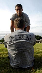 Airmen from the 628th Civil Engineer Squadron compete in the Guns vs. Hoses competition at the base picnic grounds on Joint Base Charleston, S.C., May 7, 2010. This year marked the second annual competition held between the 628th Security Forces Squadron and the 628th Civil Engineer Squadron. The competition consisted of a number of events to include a relay race and a push-up and sit-up competition. (U.S. Air Force Photo/Airman 1st Class Lauren Main)