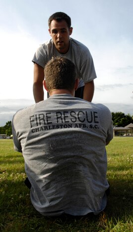 Airmen from the 628th Civil Engineer Squadron compete in the Guns vs. Hoses competition at the base picnic grounds on Joint Base Charleston, S.C., May 7, 2010. This year marked the second annual competition held between the 628th Security Forces Squadron and the 628th Civil Engineer Squadron. The competition consisted of a number of events to include a relay race and a push-up and sit-up competition. (U.S. Air Force Photo/Airman 1st Class Lauren Main)