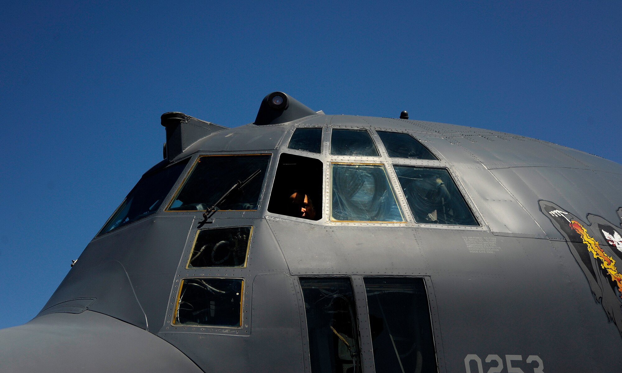 A participant of the Joint Civilian Orientation Course (JCOC) peers out the window of an AC-130U Spooky Gunship on April 29, 2010 at Hurlburt Field, Fla. JCOC is a Secretary of Defense sponsored program, which gives civilian community leaders the opportunity to learn about the military and national defense. (U.S. Air Force photo by Master Sgt. Russell E. Cooley IV)(Released)
