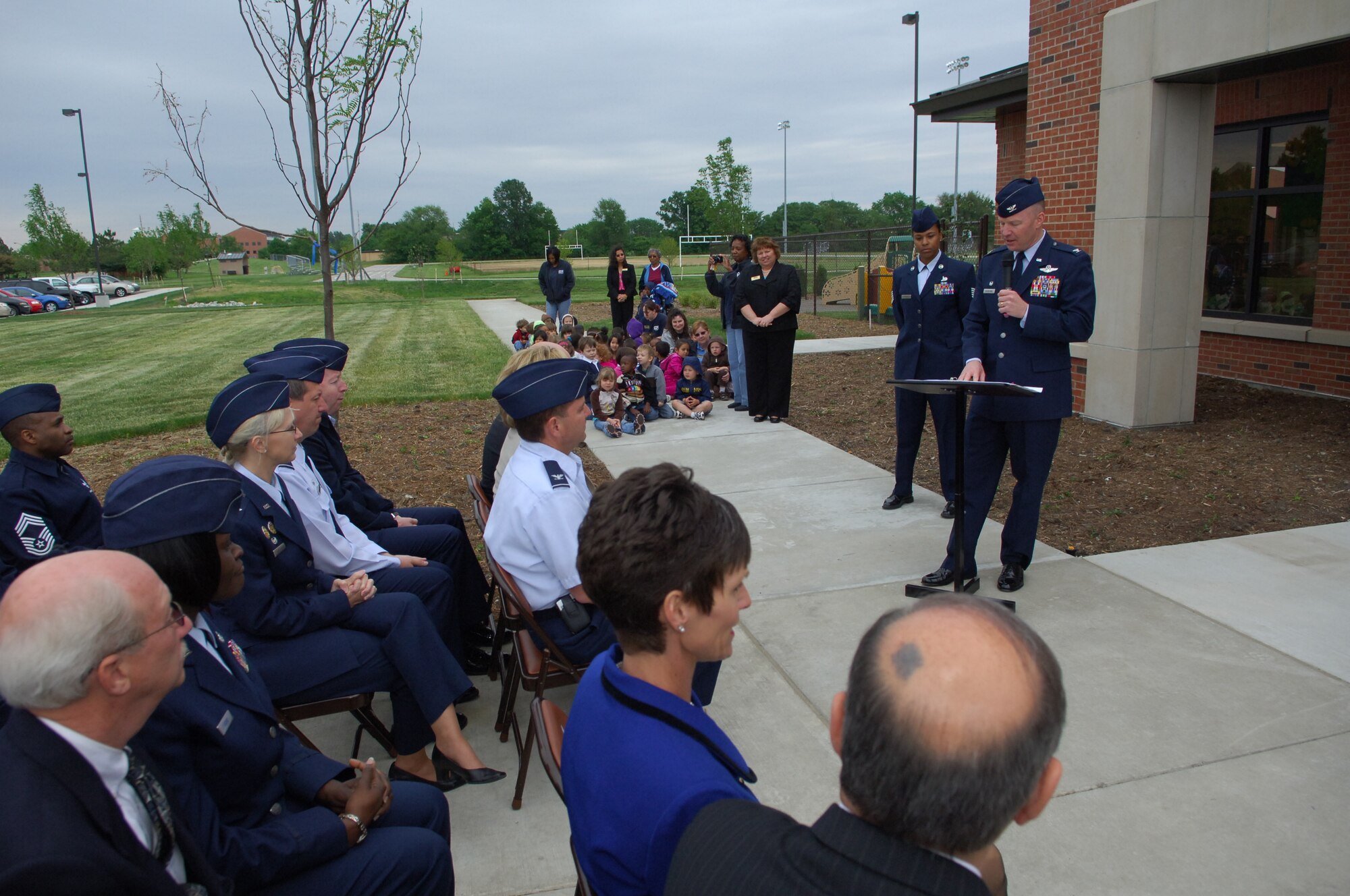 SCOTT AIR FORCE BASE, Ill. -- Col. Gary Goldstone, 375th Air Mobility Wing commander, celebrates the official opening of the new Child Development Center Monday.  Construction of the new facility was directly supported by U.S. Sen. Dick Durbin and U.S. Rep. Jerry Costello.  The new 23,000-square-foot center is large enough to accommodate 224 children ages 6 weeks to 5 years. (U.S. Air Force photo by Senior Airman Ryan Crane)