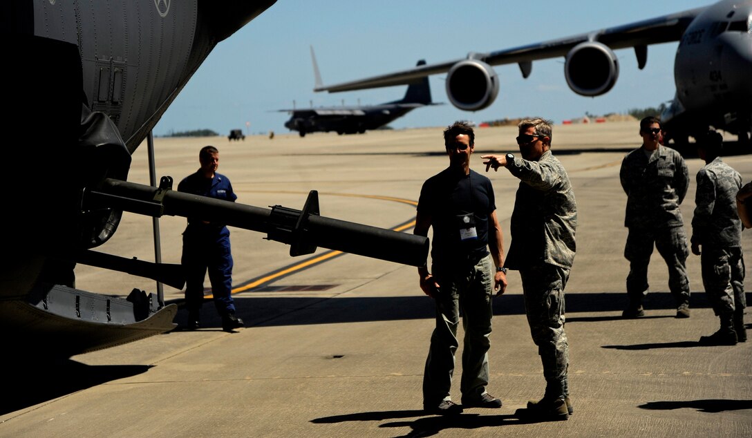 Maj. Gen. Kurt Cichowski (right), Vice Commander, Air Force Special Operations Command, talks with Tony Horton, creator of the P90X and participant of the Joint Civilian Orientation Course (JCOC) about the weapon systems on an AC-130U Spooky Gunship on April 29, 2010 at Hurlburt Field, Fla. JCOC is a Secretary of Defense sponsored program, which gives civilian community leaders the opportunity to learn about the military and national defense. (U.S. Air Force photo by Master Sgt. Russell E. Cooley IV)(Released)