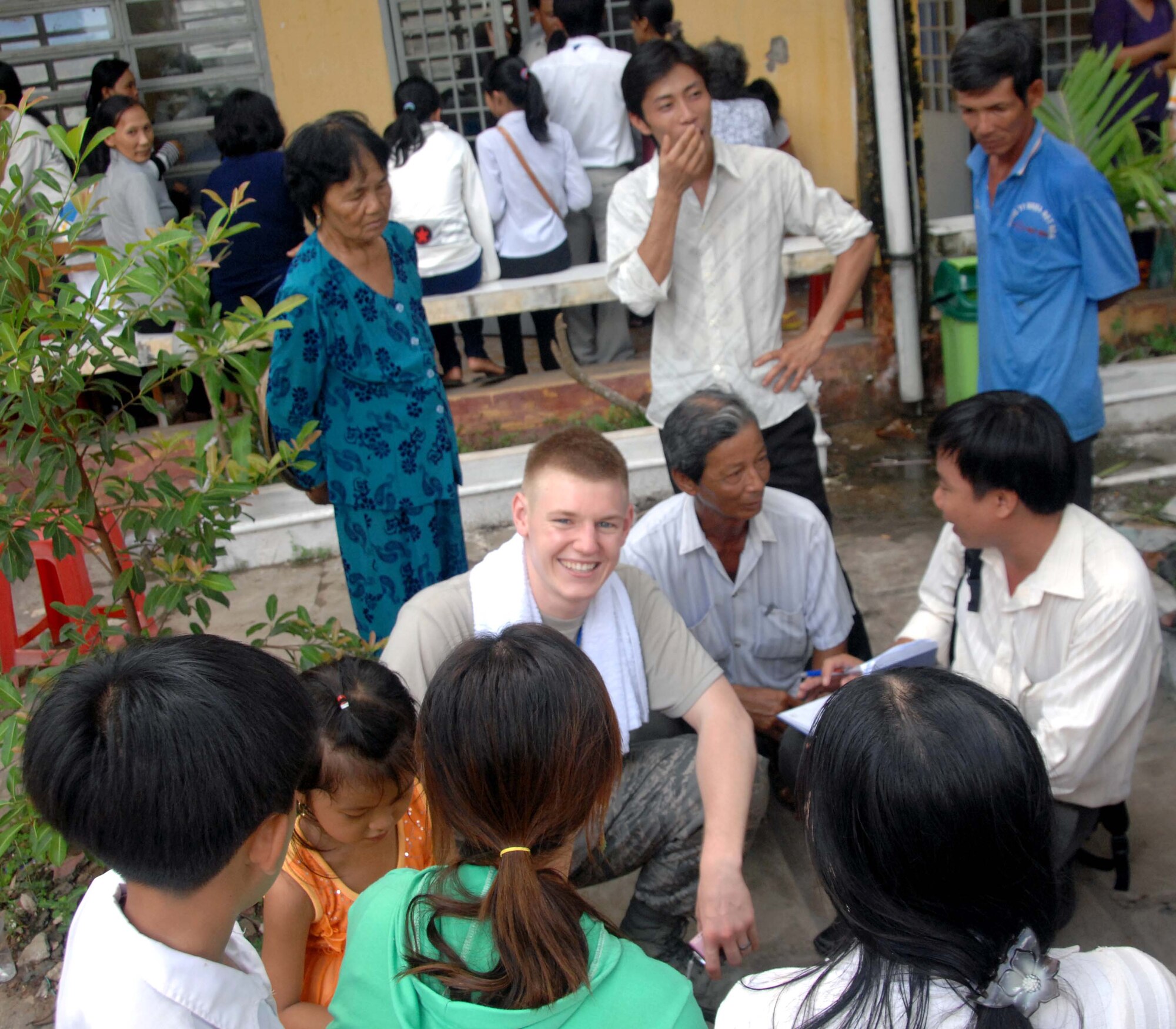 Senior Airman Rob Kranz, a medical technician from Elmendorf Air Force Base, Alaska, takes a moment to rest and interact with some local children during Operation Pacific Angel 2010 in Can Tho, Vietnam, on May 12, 2010. Operation Pacific Angel is a joint and combined humanitarian assistance operation conducted in the Pacific area of responsibility to support U.S. Pacific Command's capacity-building efforts.
More than 50 U.S. military members are working alongside the Vietnamese military, non-governmental organizations and civil health and engineering personnel in medical and engineering efforts during the mission scheduled through May 15. (U.S. Air Force photo/ Capt. Timothy Lundberg)
