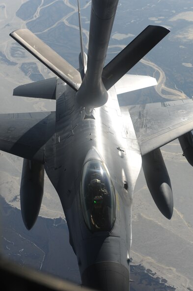 An F-16 Fighting Falcon receives fuel from a KC-135 Stratotanker from the 319th Air Refueling Wing during a Coronet West May 8. A Coronet West is the title given to a group of jet fighters flying with necessary refueling capabilities and maintenance support, eliminating the need to land. The F-16 was flying to Kunsan, Korea. (U.S. Air Force photo by Staff Sgt. Suellyn Nuckolls)