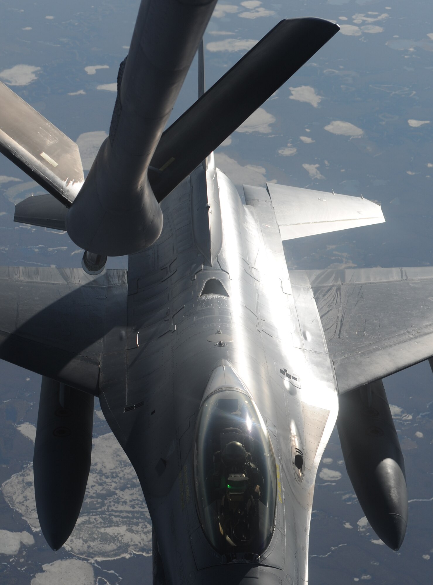 An F-16 Fighting Falcon aligns to a KC-135 Stratotanker from the 319th Air Refueling Wing to receive fuel during a Coronet West May 8. A Coronet West is the title given to a group of jet fighters flying with necessary refueling capabilities and maintenance support, eliminating the need to land. The F-16 was flying to Kunsan, Korea. (U.S. Air Force photo by Staff Sgt. Suellyn Nuckolls)