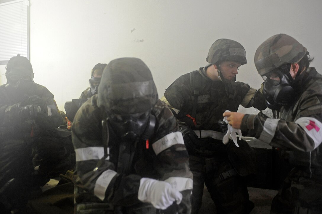 ELLSWORTH AIR FORCE BASE, S.D. – 28th Medical Group personnel don mission oriented protective posture gear during a Phase II Operational Readiness Exercise, May 12. The Phase II ORE tested the Airmen’s ability to operate in a deployed environment. (U.S. Air Force photo/Airman 1st Class Matthew Flynn)
