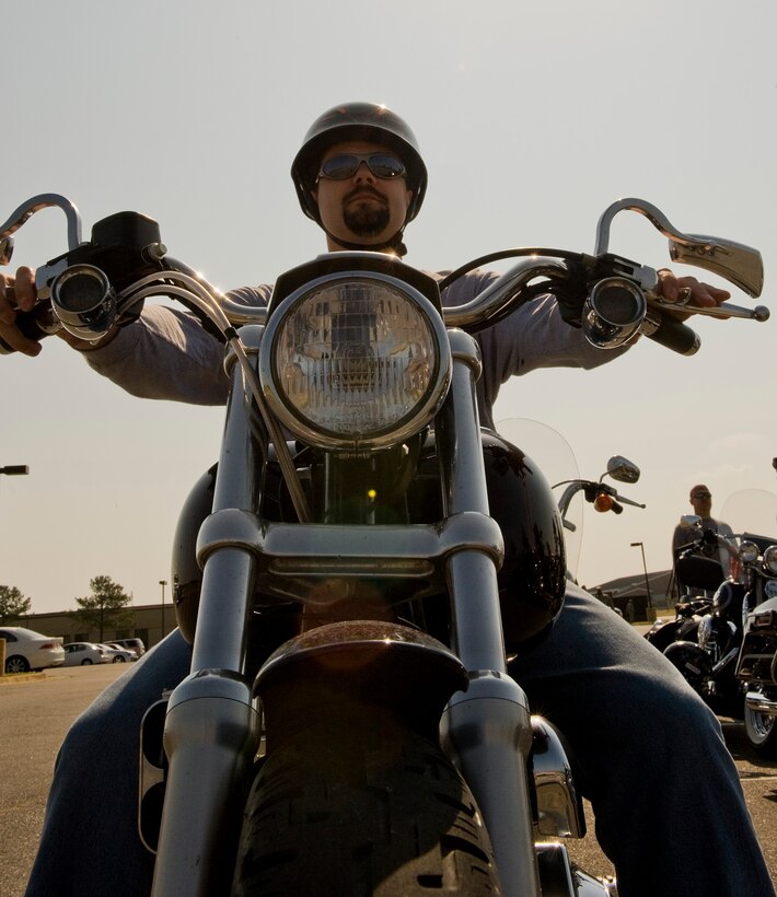 LANGLEY AIR FORCE BASE, Va. -- Kevin Duvall, husband of Tech. Sgt. Monique Jose-Duvall, 633d Public Affairs broadcaster, prepares to depart on his motorcycle  May 12.  The motorcycle ride was part of National Police Week, a celebration in honor of law enforcement officers who lost their lives in the line of duty. (U.S. Air Force photo/Senior Airman Zachary Wolf)