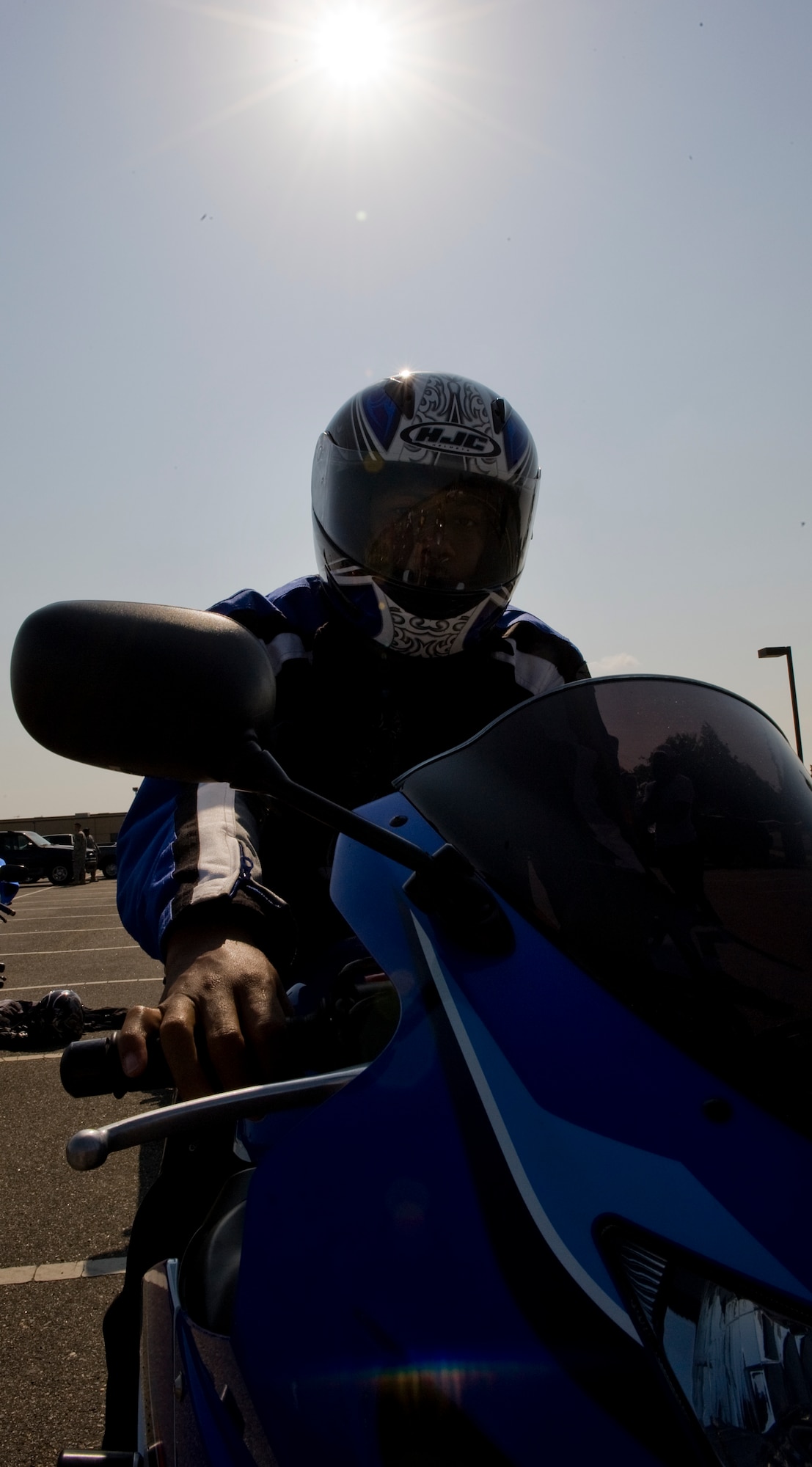 LANGLEY AIR FORCE BASE, Va. -- Staff Sgt. Marvin Kelker, 633d Security Forces Squadron patrolman, prepares his motorcycle May 12. The motorcycle ride was part of National Police Week, a celebration in honor of law enforcement officers who lost their lives in the line of duty. (U.S. Air Force photo/Senior Airman Zachary Wolf)