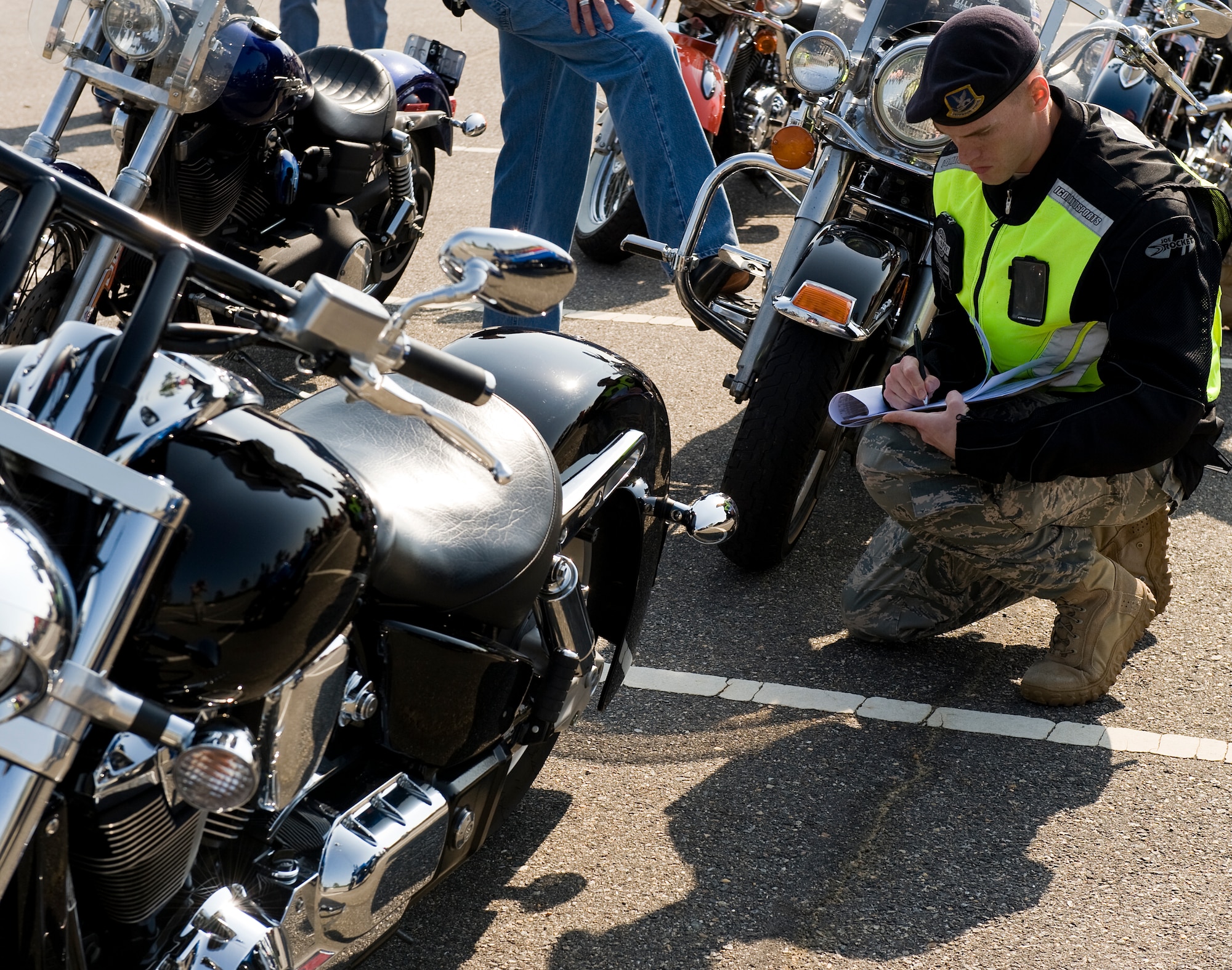 LANGLEY AIR FORCE BASE, Va. -- Staff Sgt. Brandon Phelps, 633d Security Forces Squadron unit training instructor, performs a safety inspection May 12. The motorcycle ride was part of National Police Week, a celebration in honor of law enforcement officers who lost their lives in the line of duty. (U.S. Air Force photo/Senior Airman Zachary Wolf)