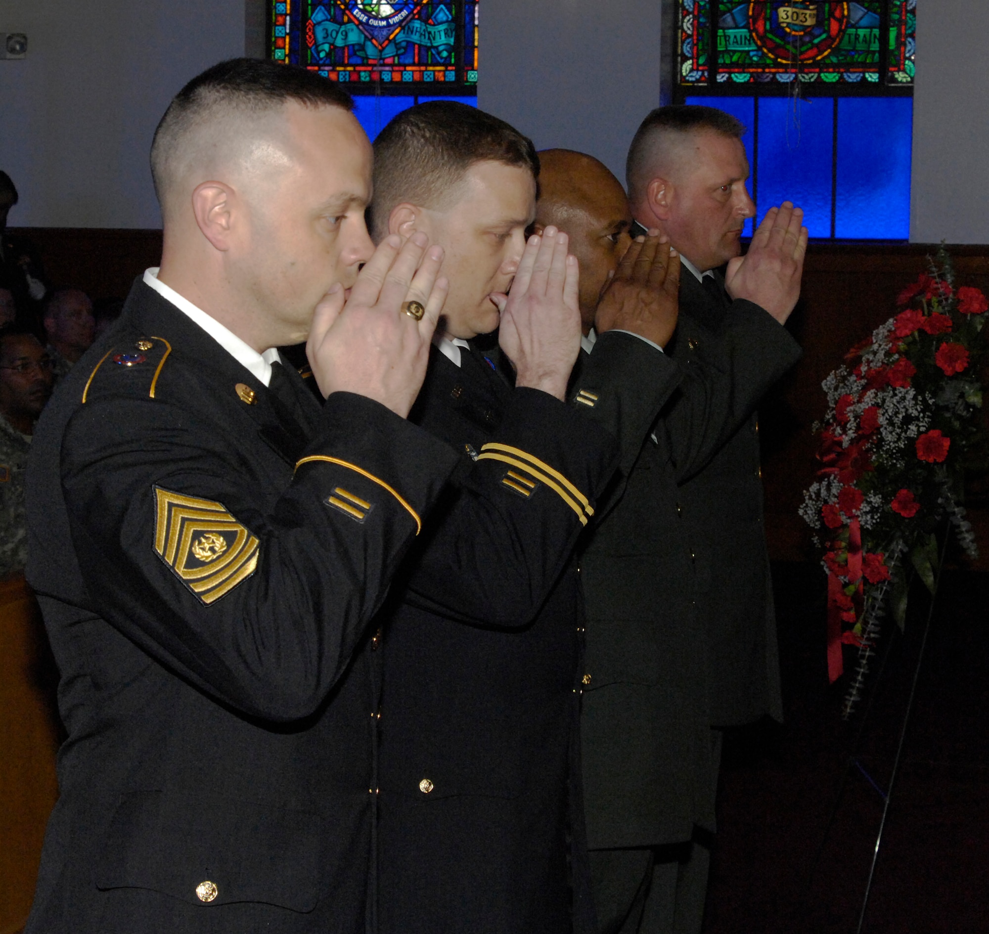 Soliders of the Army Reserve Noncommissioned Officer Academy render a final salute to their fallen comrade, Sgt. 1st Class Mary Russell, at the Dix Main Chapel May 4. Russell died of injuries sustained in a vehicle accident April 20. (U.S. Army photo/ Wayne Cook)