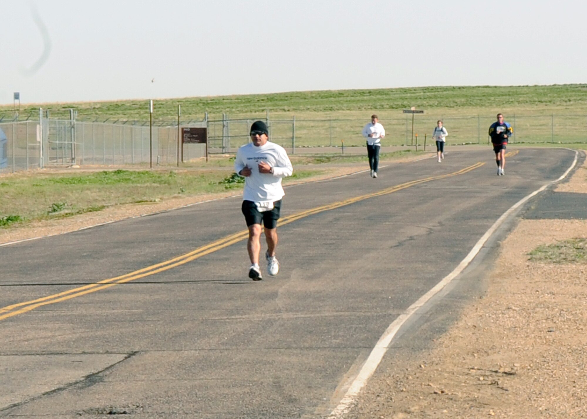 BUCKLEY AIR FORCE BASE, Colo. -- Runners near the half way point during the Fourth Annual Half Marathon. ( U.S. Air Force Photo by Airman 1st Class Marcy Glass )
